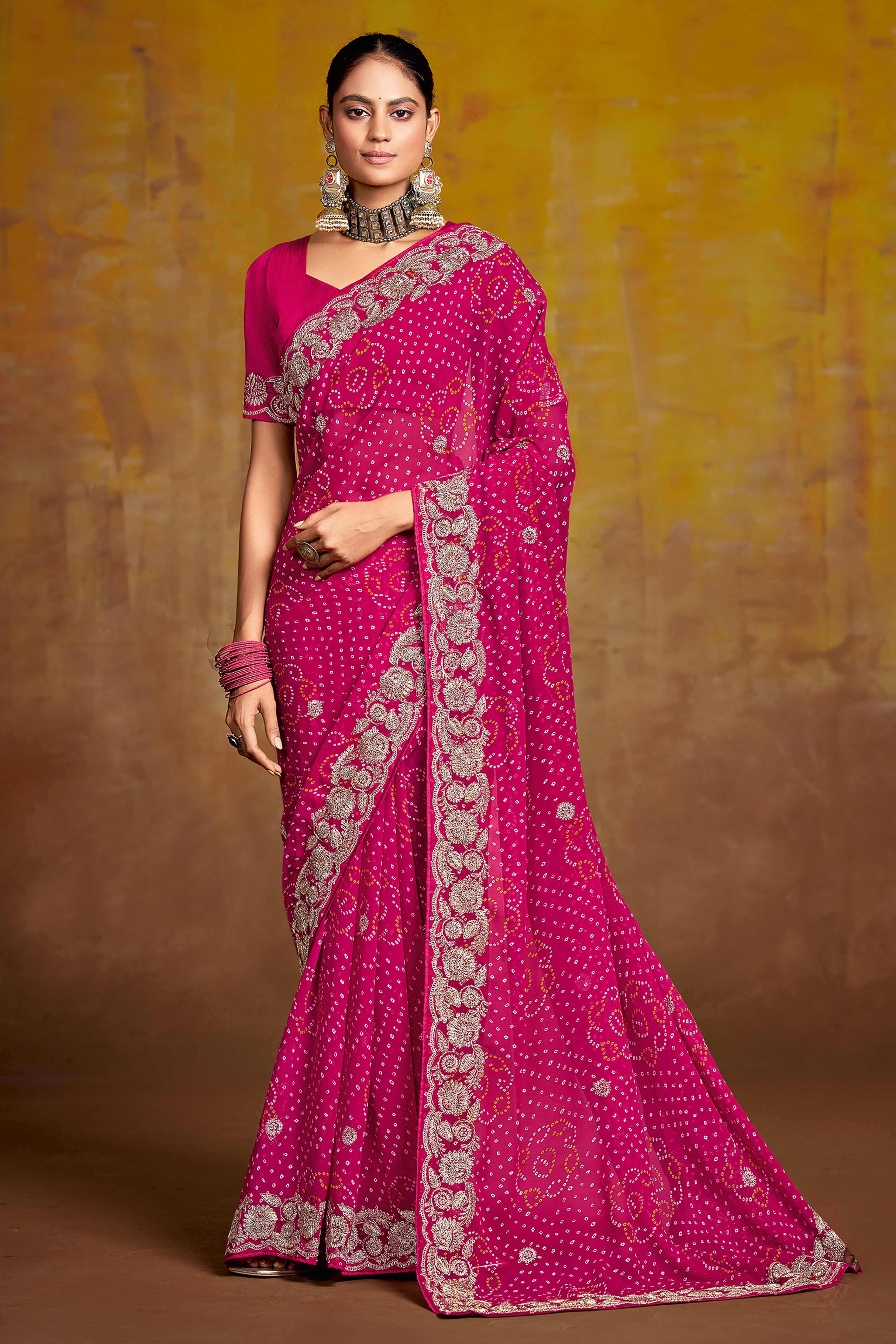 Pink Georgette Saree Adorned With Traditional Bandhani Prints & Intricate Floral Embroidery