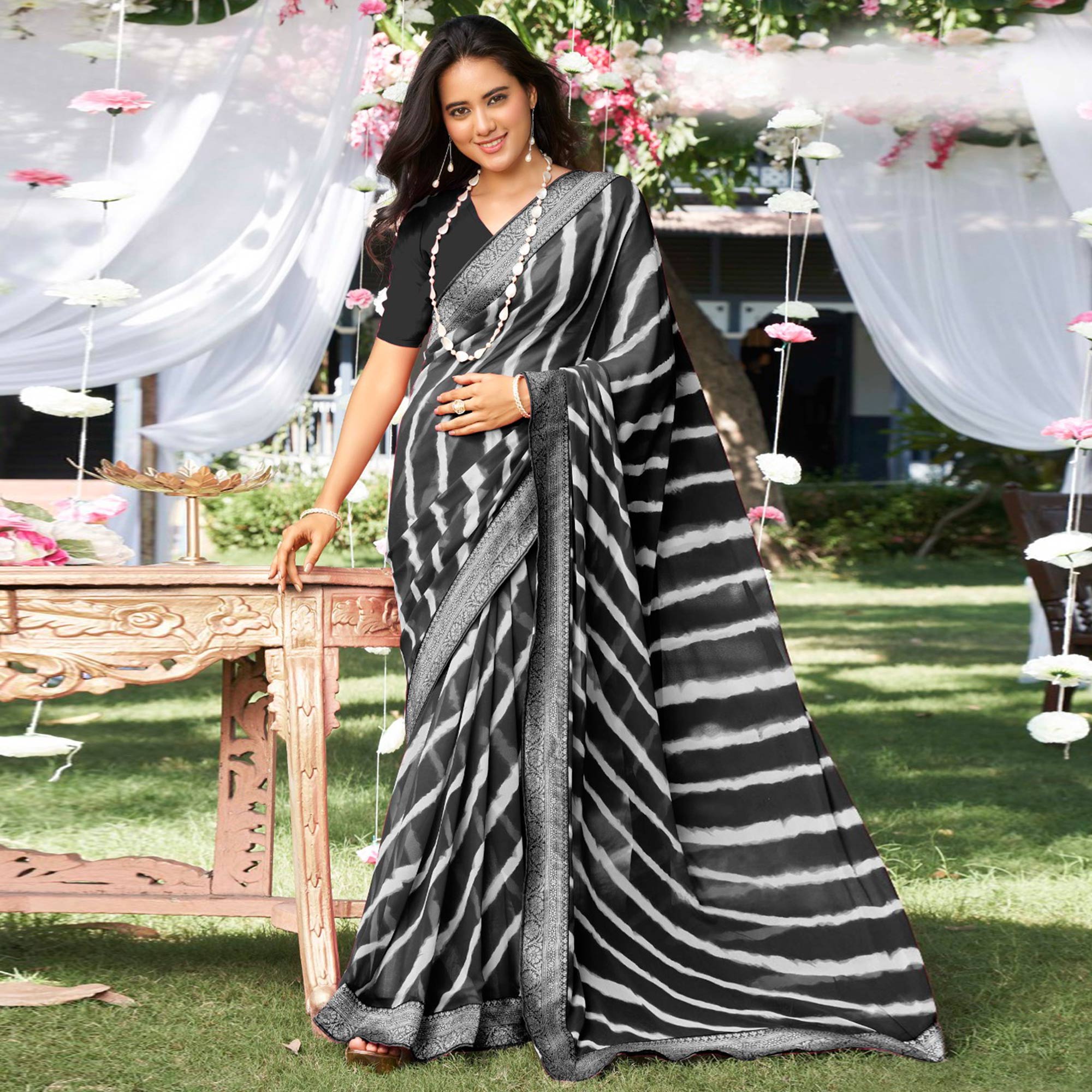Black Leheriya Printed With Woven Border Georgette Saree