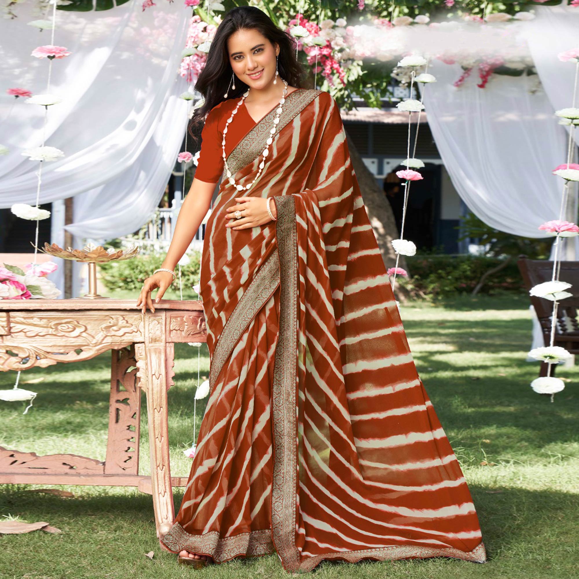 Rust Leheriya Printed With Woven Border Georgette Saree