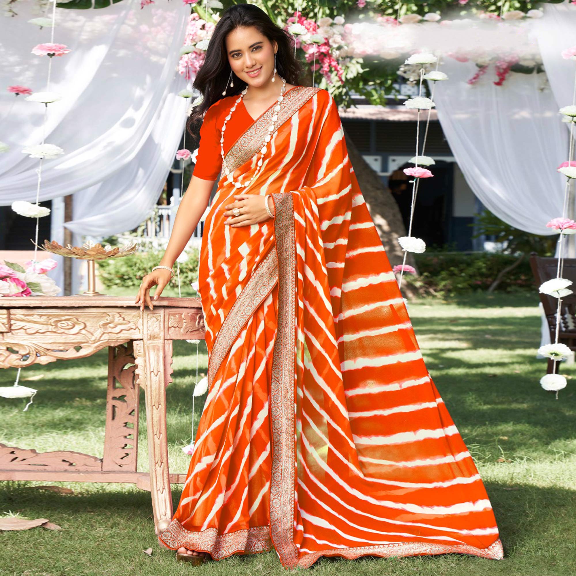 Orange Leheriya Printed With Woven Border Georgette Saree