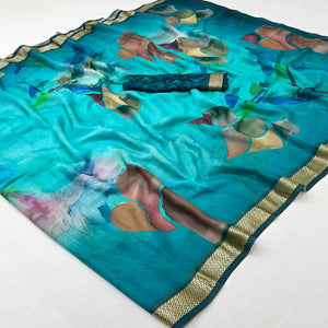 Graceful Turquoise Georgette Saree Accented With Digital Prints & Viscose Border Finish