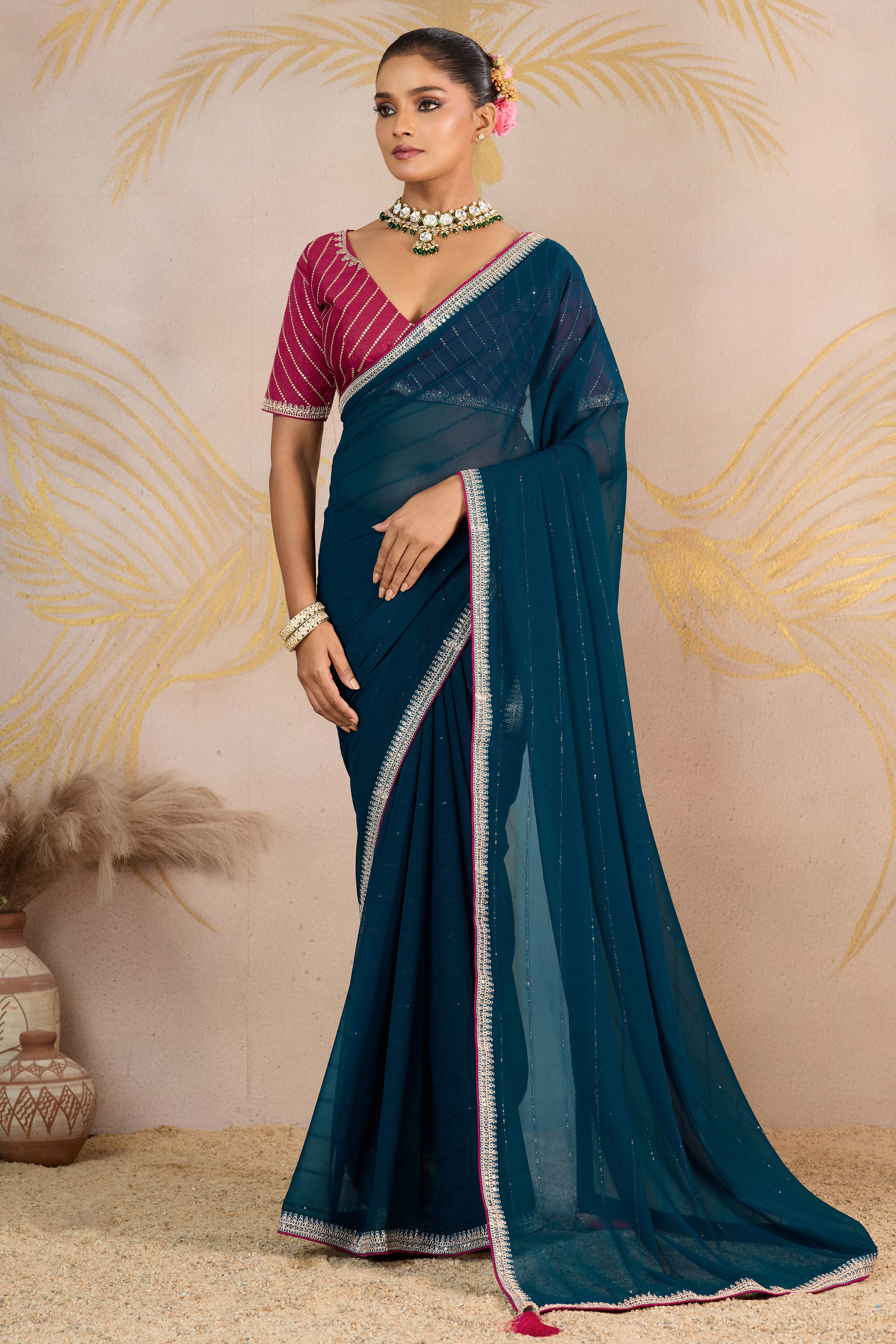 Teal Zari Embroidered Georgette Saree Accented With Sequins