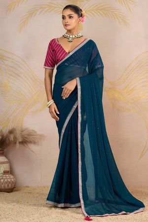 Teal Zari Embroidered Georgette Saree Accented With Sequins