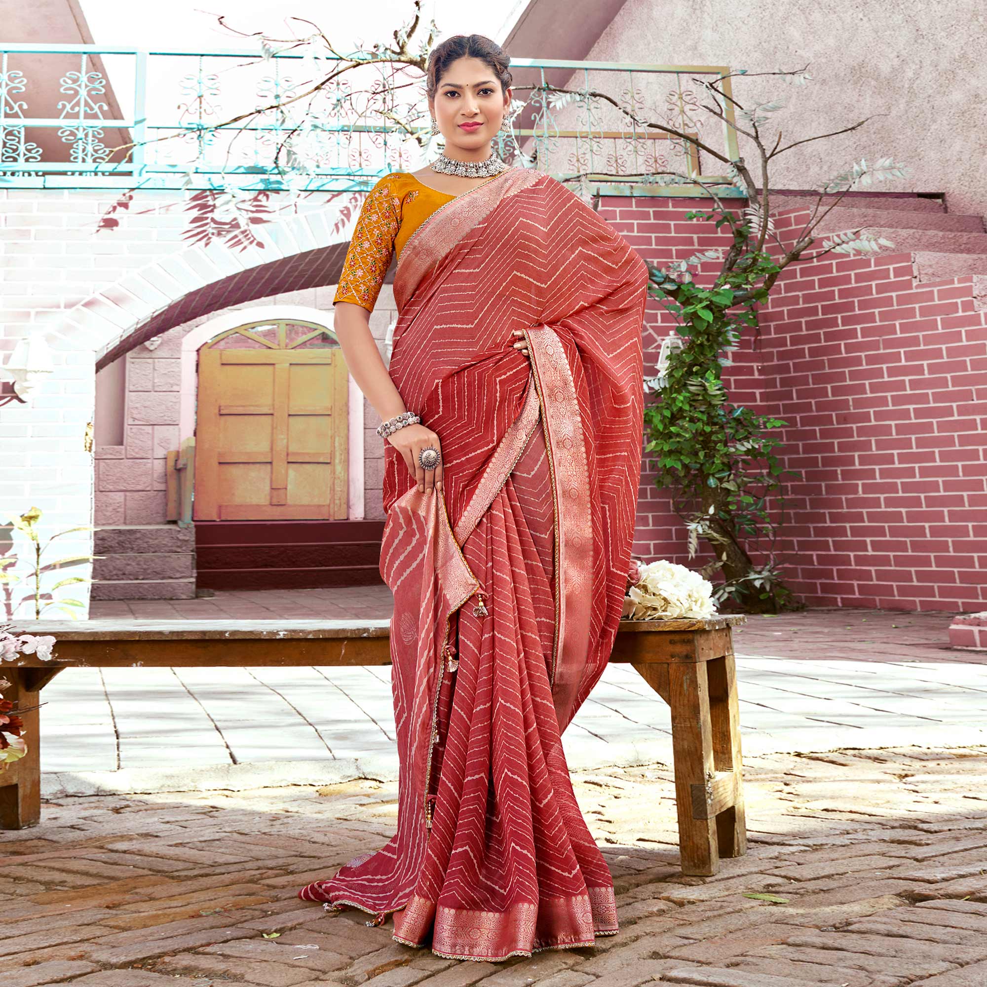 Salmon Pink Leheriya Printed Georgette Saree With Jacquard Border