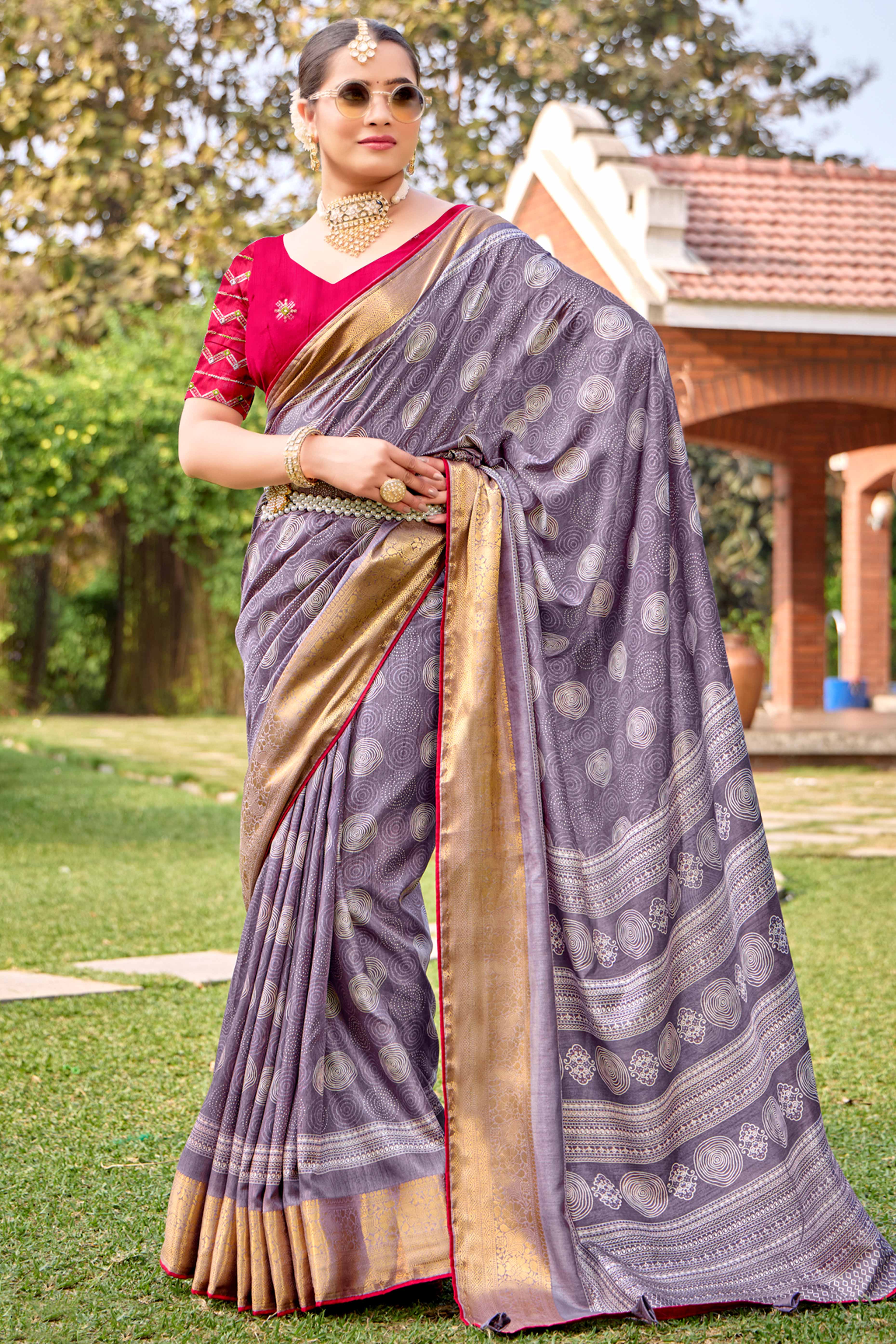 Lavender Printed Dola Silk Saree With Ornate Zari Border & Tassel Pallu