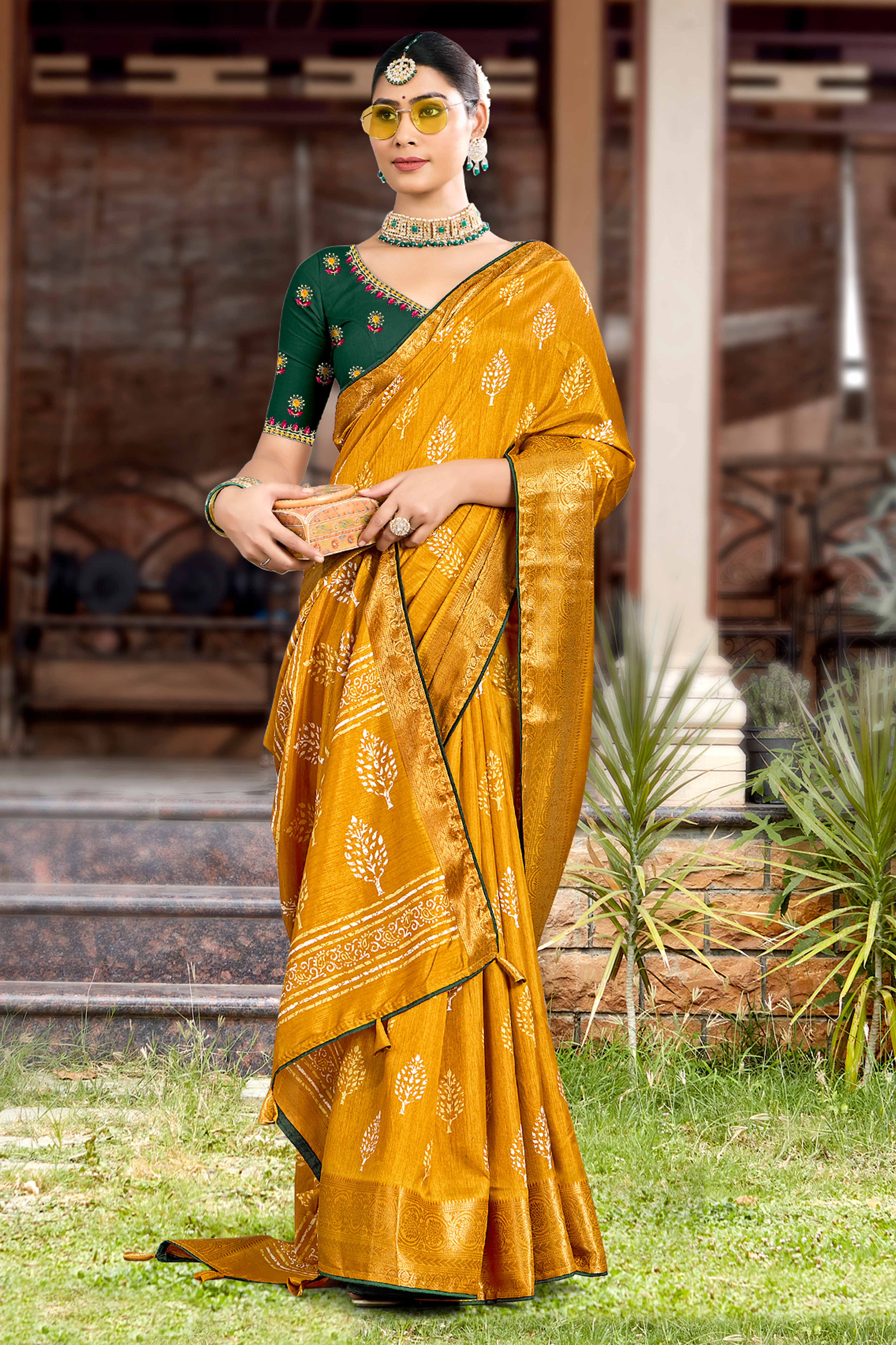 Mustard Dola Silk Saree Featuring Artistic Print Work & Graceful Tassel Edging