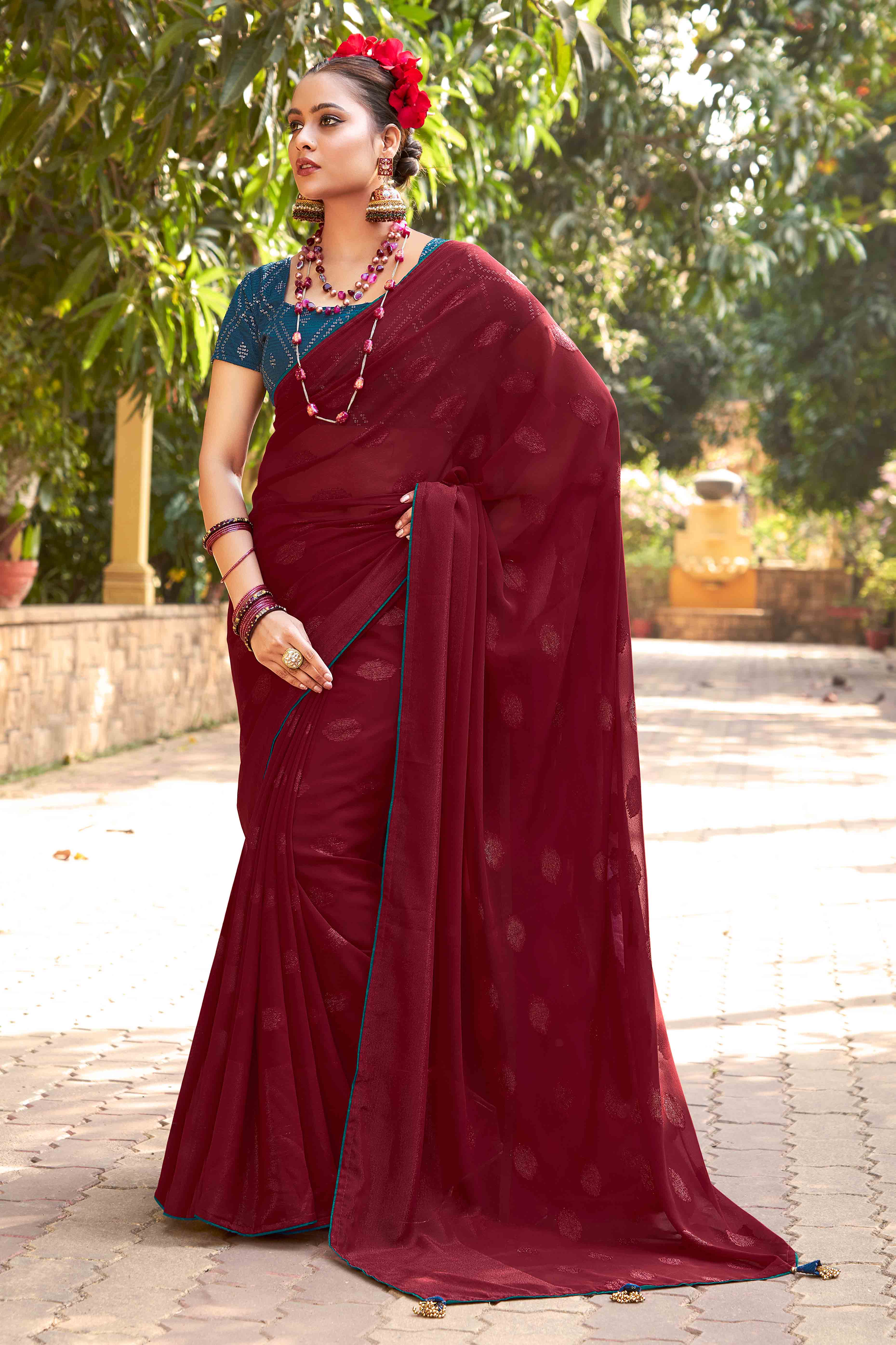 Maroon Woven Georgette Saree With Tassels