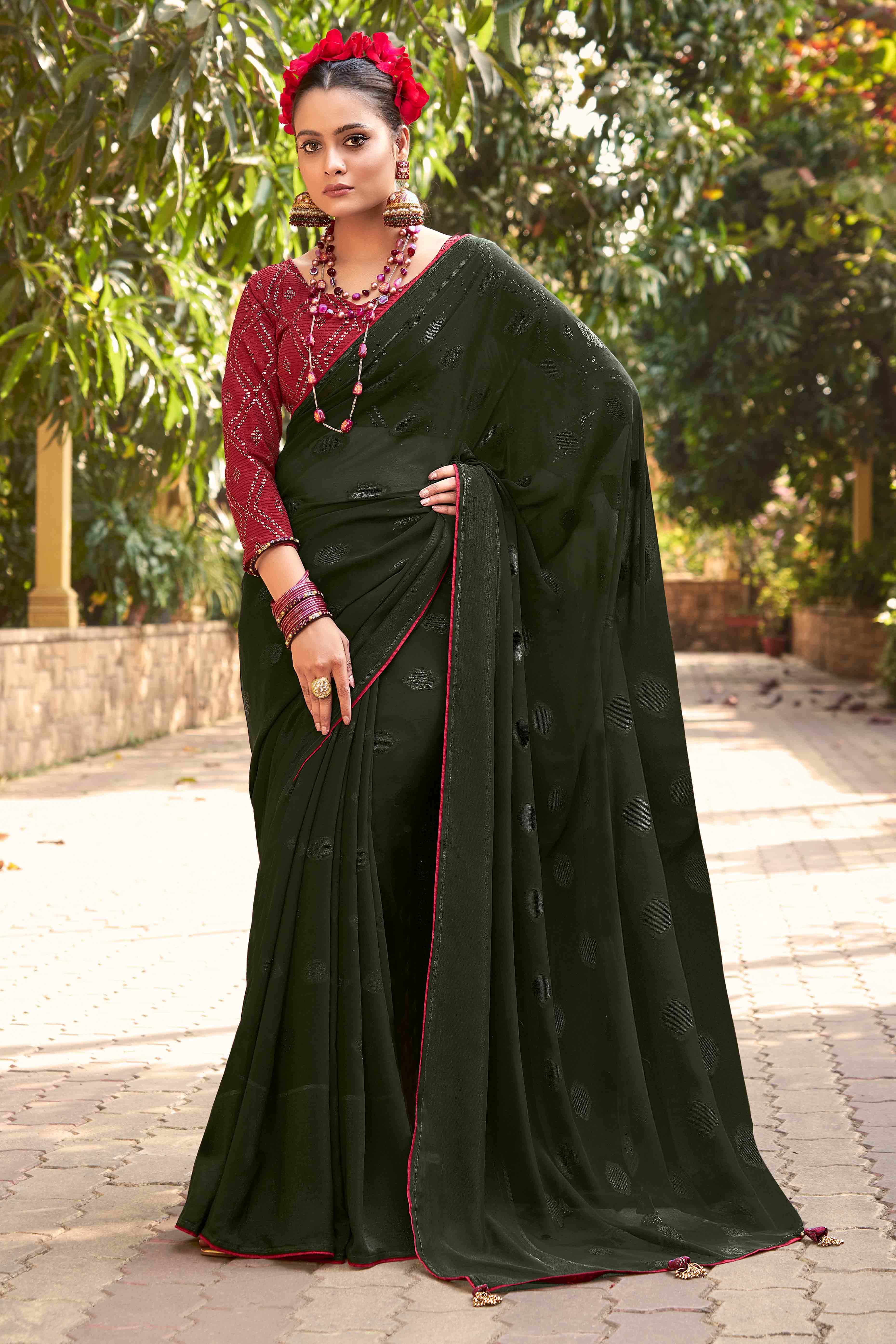 Bottle Green Woven Georgette Saree With Tassels