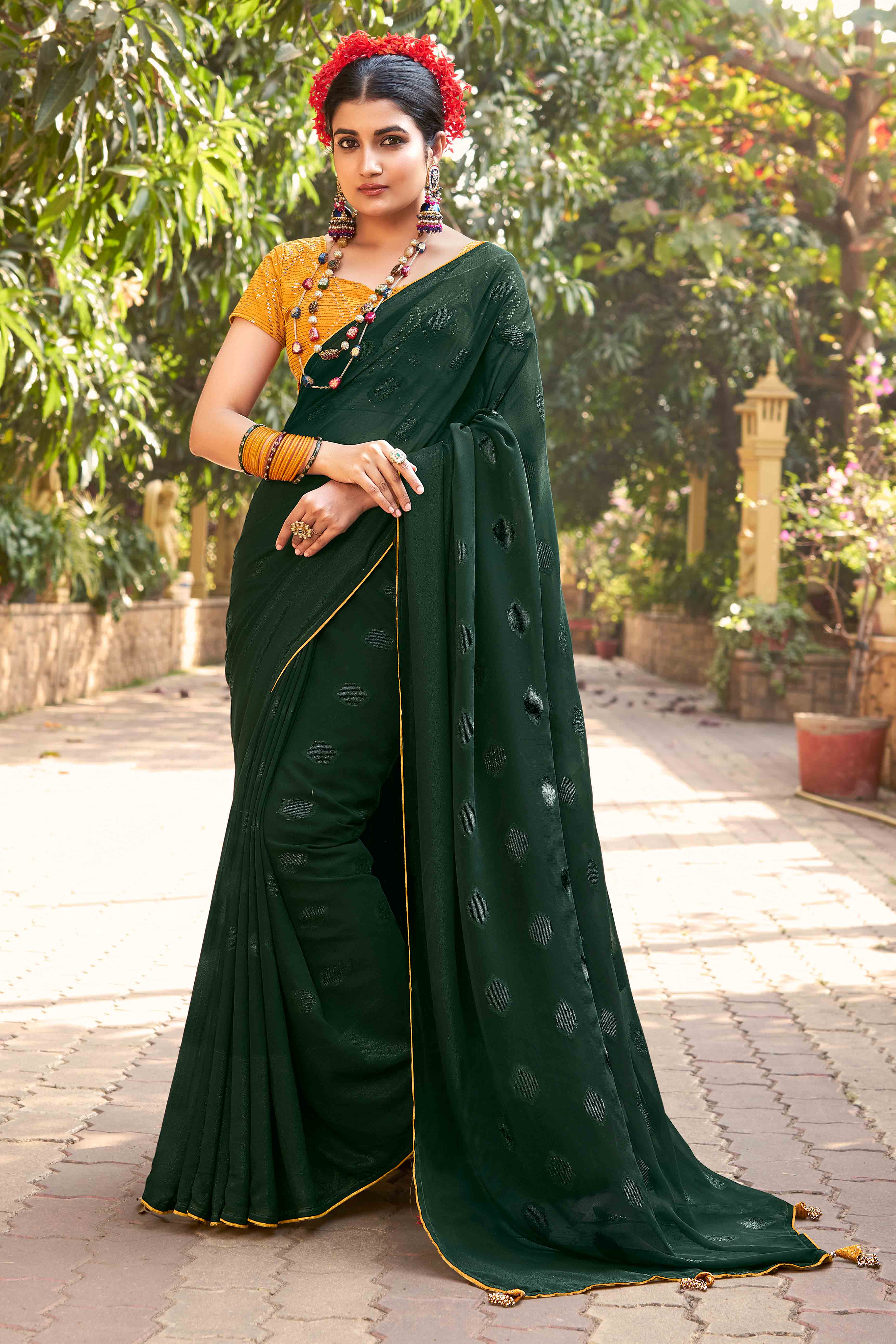 Green Woven Georgette Saree With Tassels