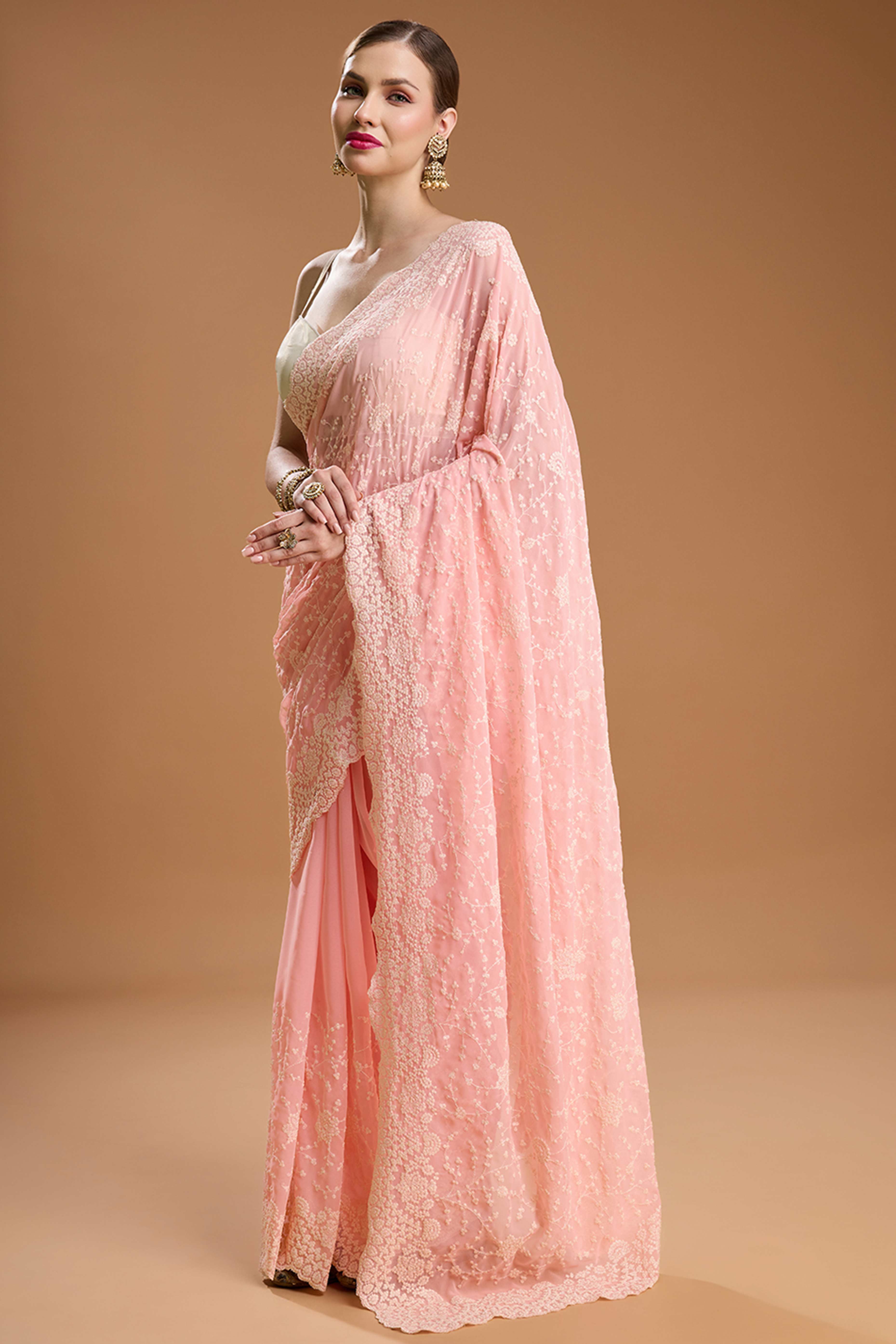 Soft Pastel Pink Embroidered Georgette Saree Featuring Thread Detailing