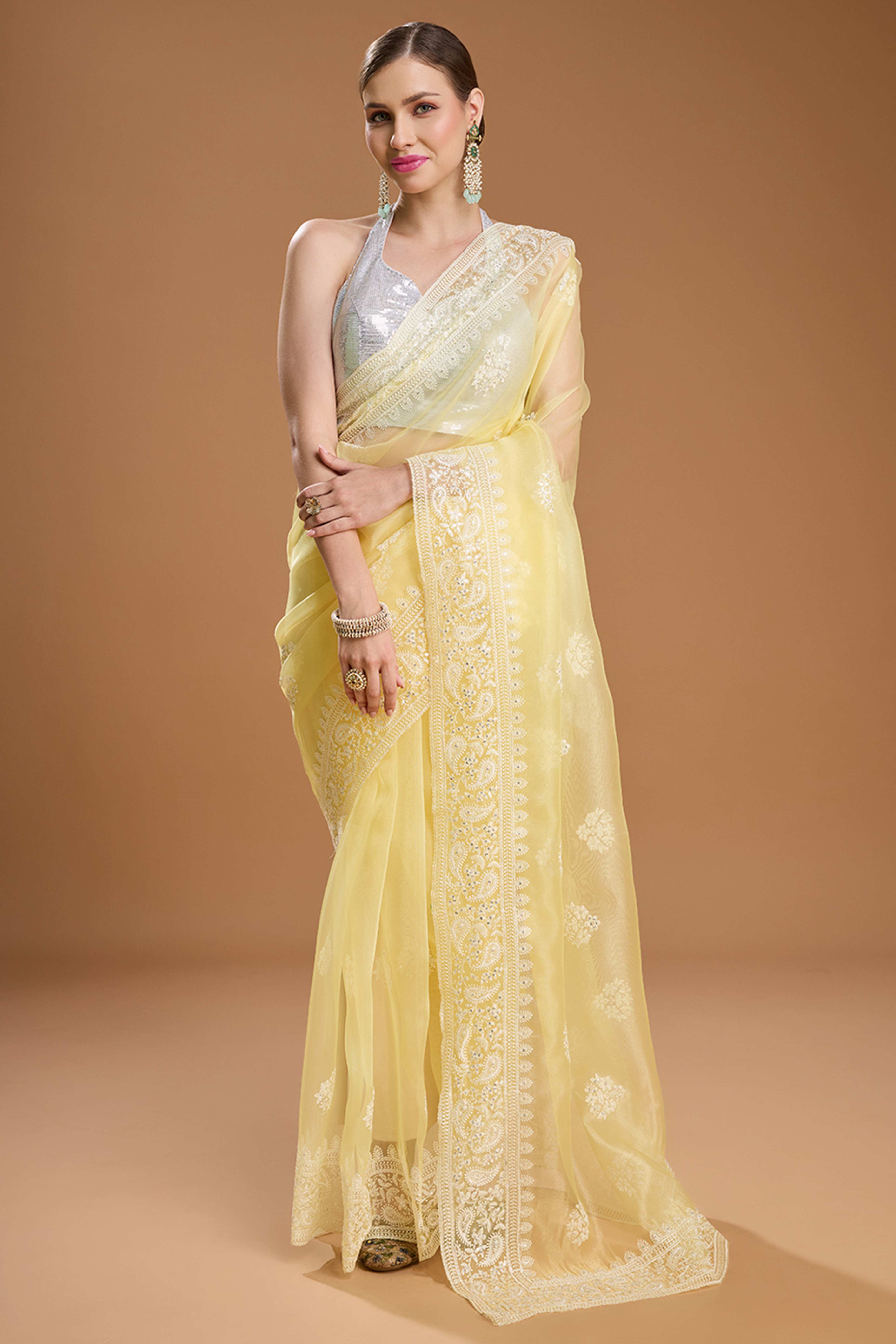 Light Yellow Net Saree Enhanced with Elegant Sequins Embellishments