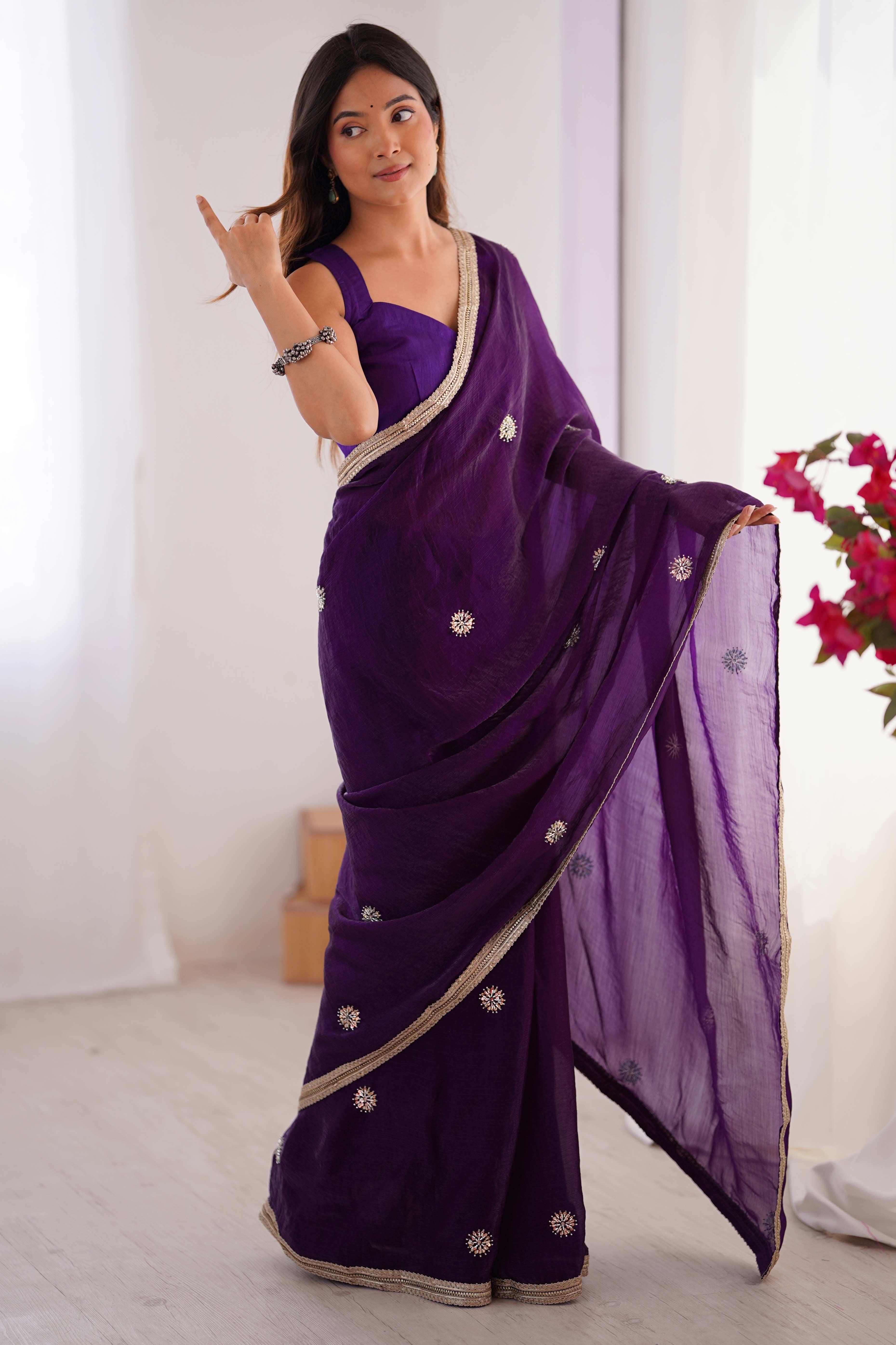Elegant Deep Purple Organza Saree with Delicate Floral Embellishments and Lace Border