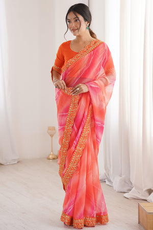 Graceful Orange Foil Print Georgette Saree Featuring A Luxurious Cording Sequins Embroidered Border