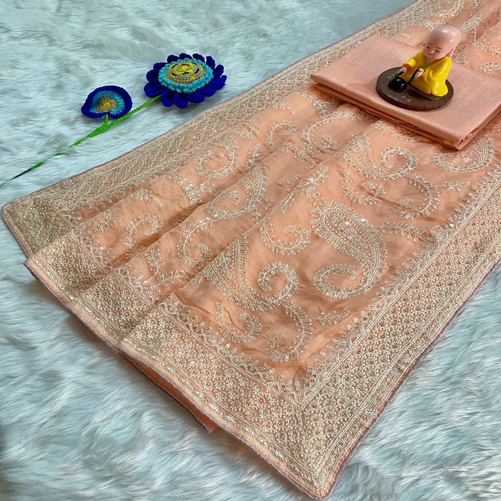 Lustrous Light Orange Organza Silk Saree Beautified With Paisley Embroidery & Glittering Sequins