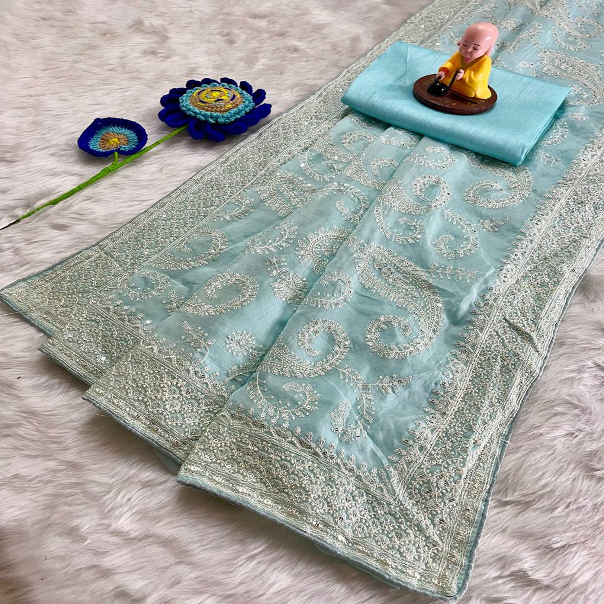 Lustrous Sky Blue Organza Silk Saree Beautified With Paisley Embroidery & Glittering Sequins Work