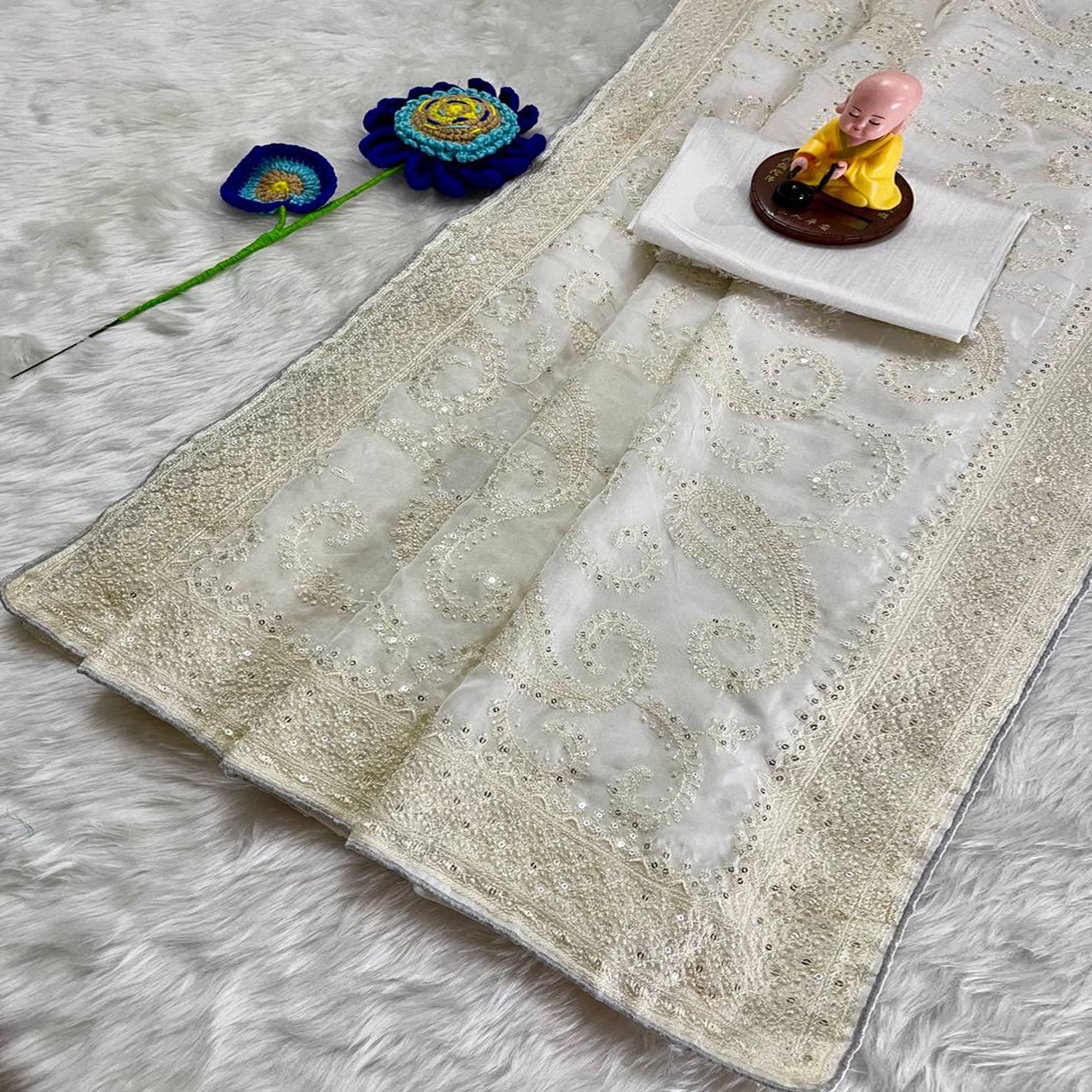 Lustrous White Organza Silk Saree Beautified With Paisley Embroidery & Glittering Sequins Work