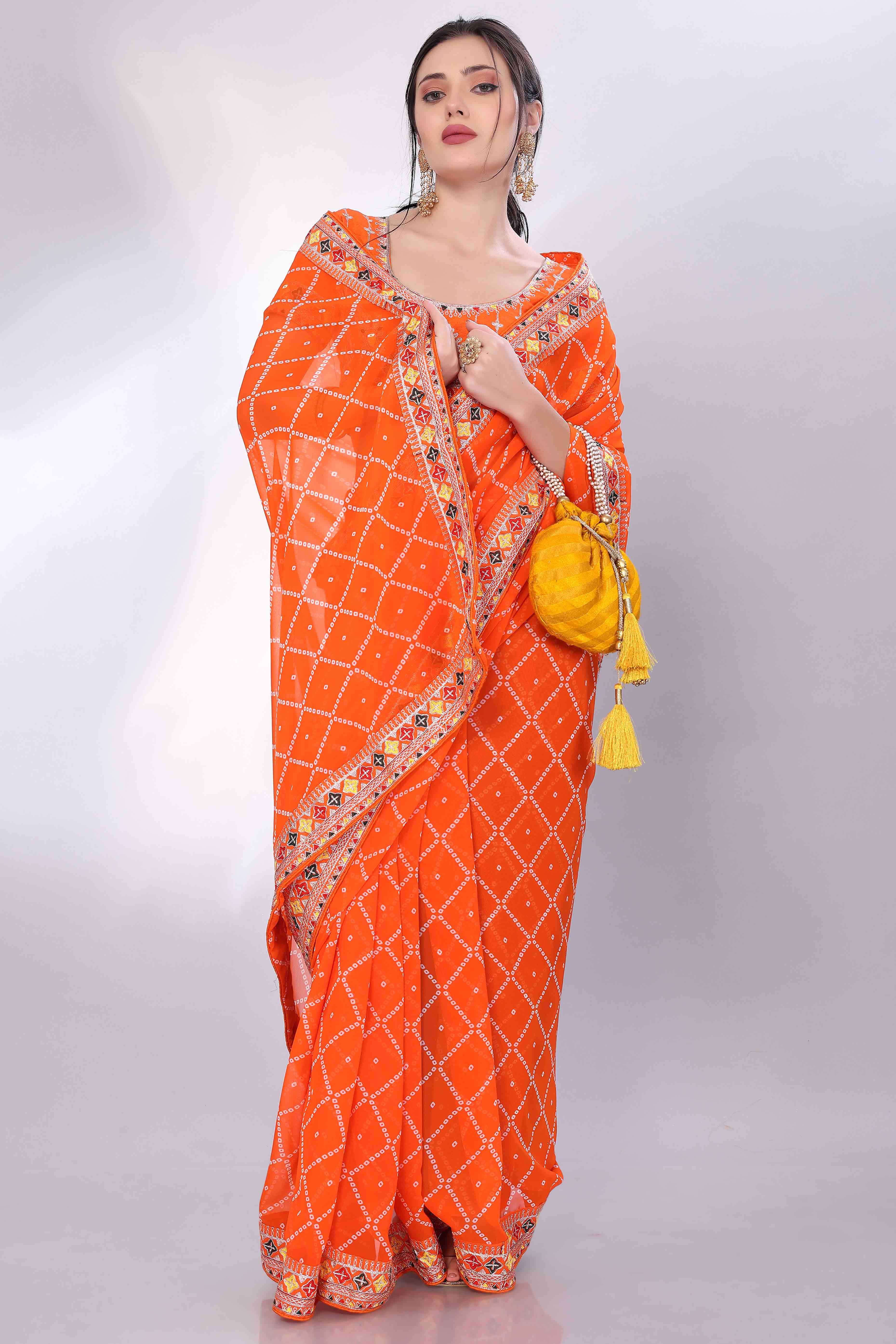 Orange Bandhani Printed Georgette Saree Framed With Elegant Embroidered Border