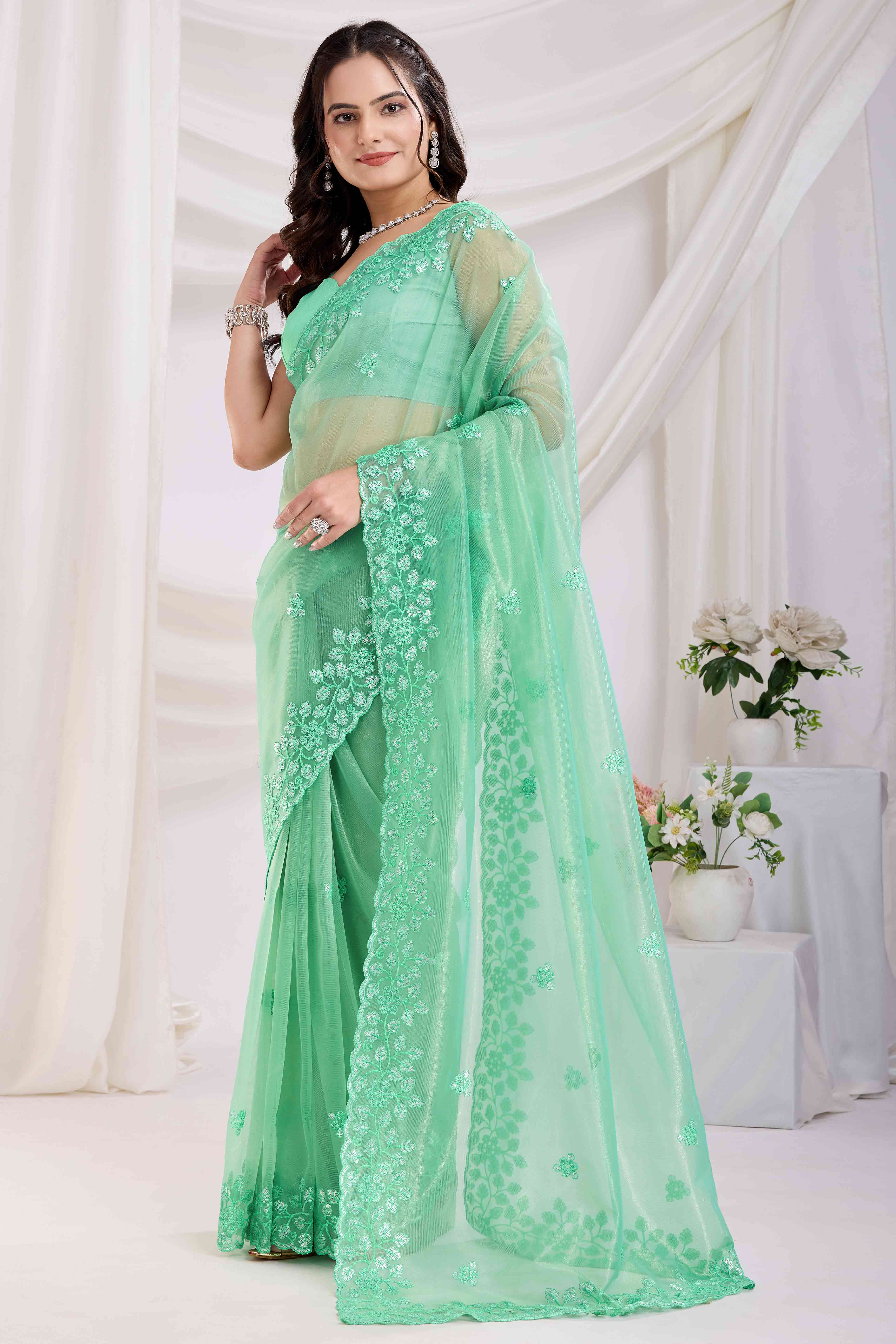 Sea Green Floral Sequins Embroidered Twill Net Saree
