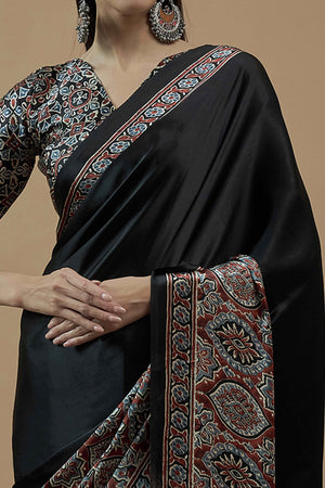 Black Floral Ajrakh Printed Satin Saree With Tassels
