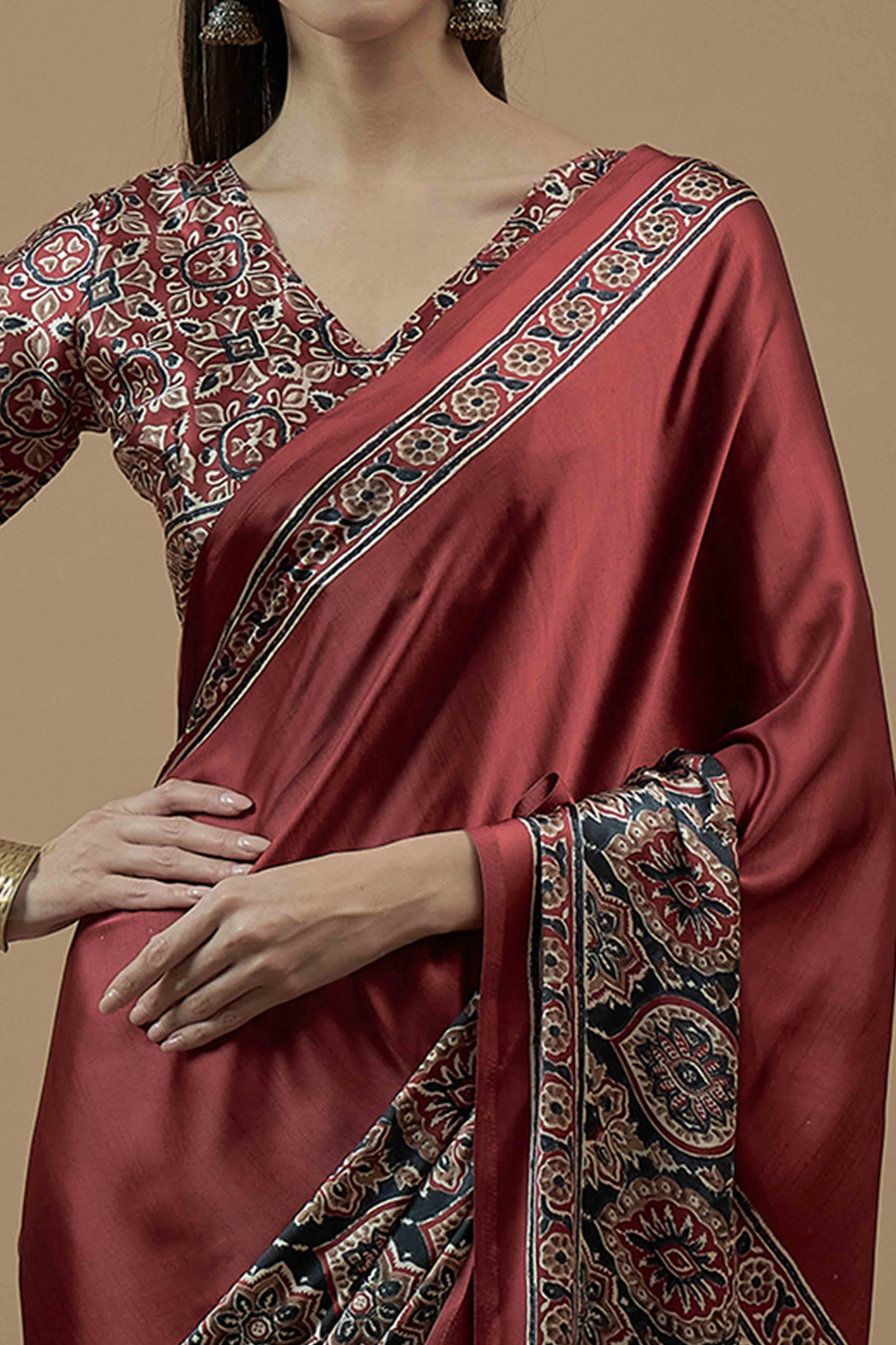 Rust Floral Ajrakh Printed Satin Saree With Tassels