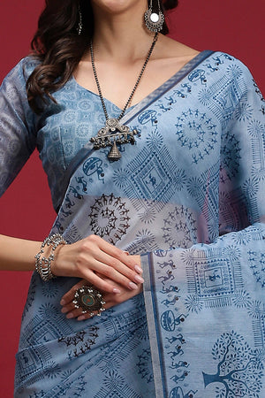 Powder Blue Linen Cotton Saree Featuring Traditional Warli Prints & Tassel Pallu