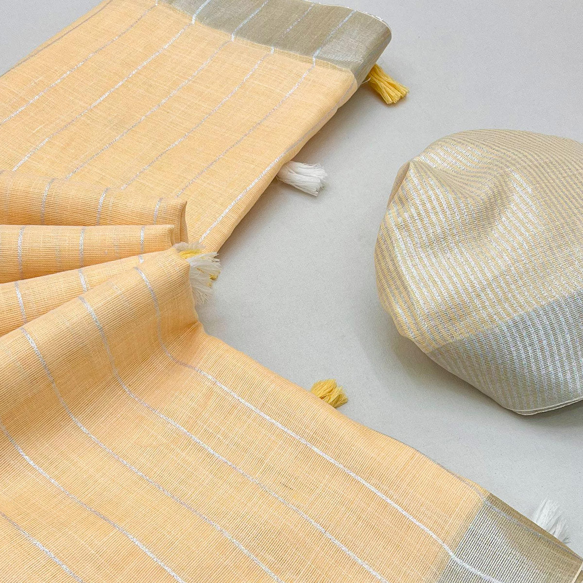 Light Orange Zari Woven Linen Saree With Tassels