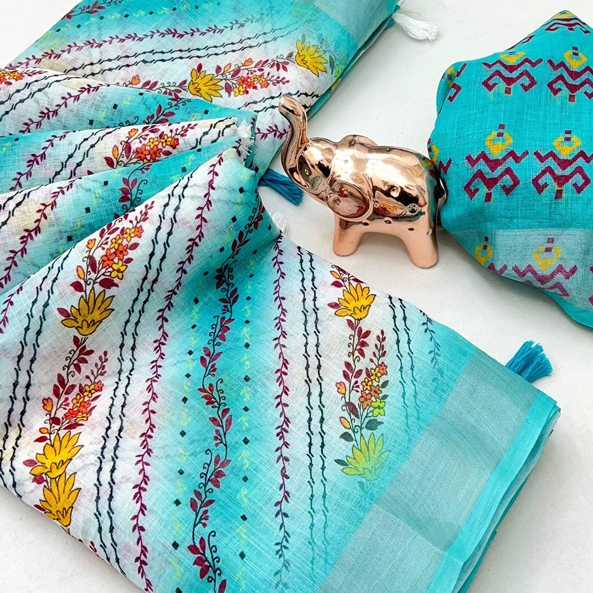 Turquoise Soft Linen Saree with Artistic Print Detailing