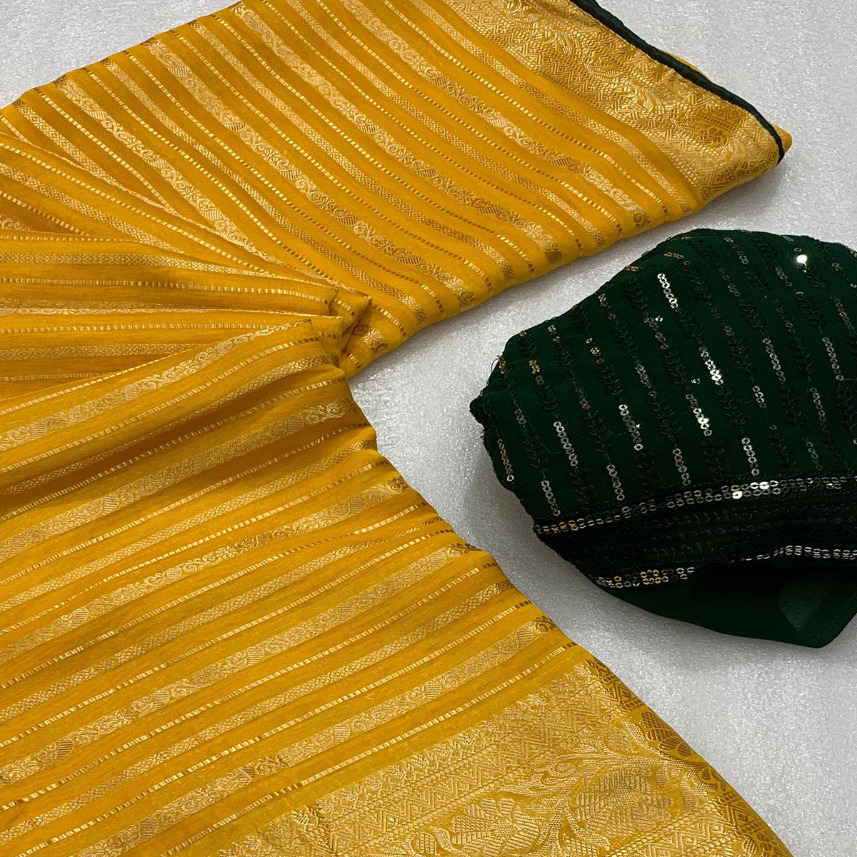 Yellow & Green Woven Georgette Saree With Tassels