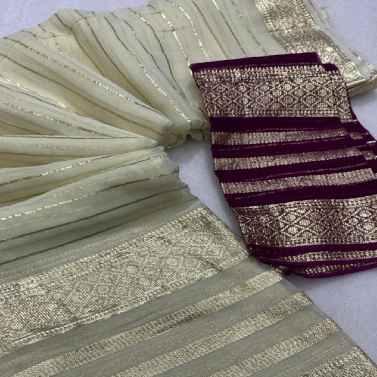 Offwhite & Purple Striped Zari Woven Viscose Saree