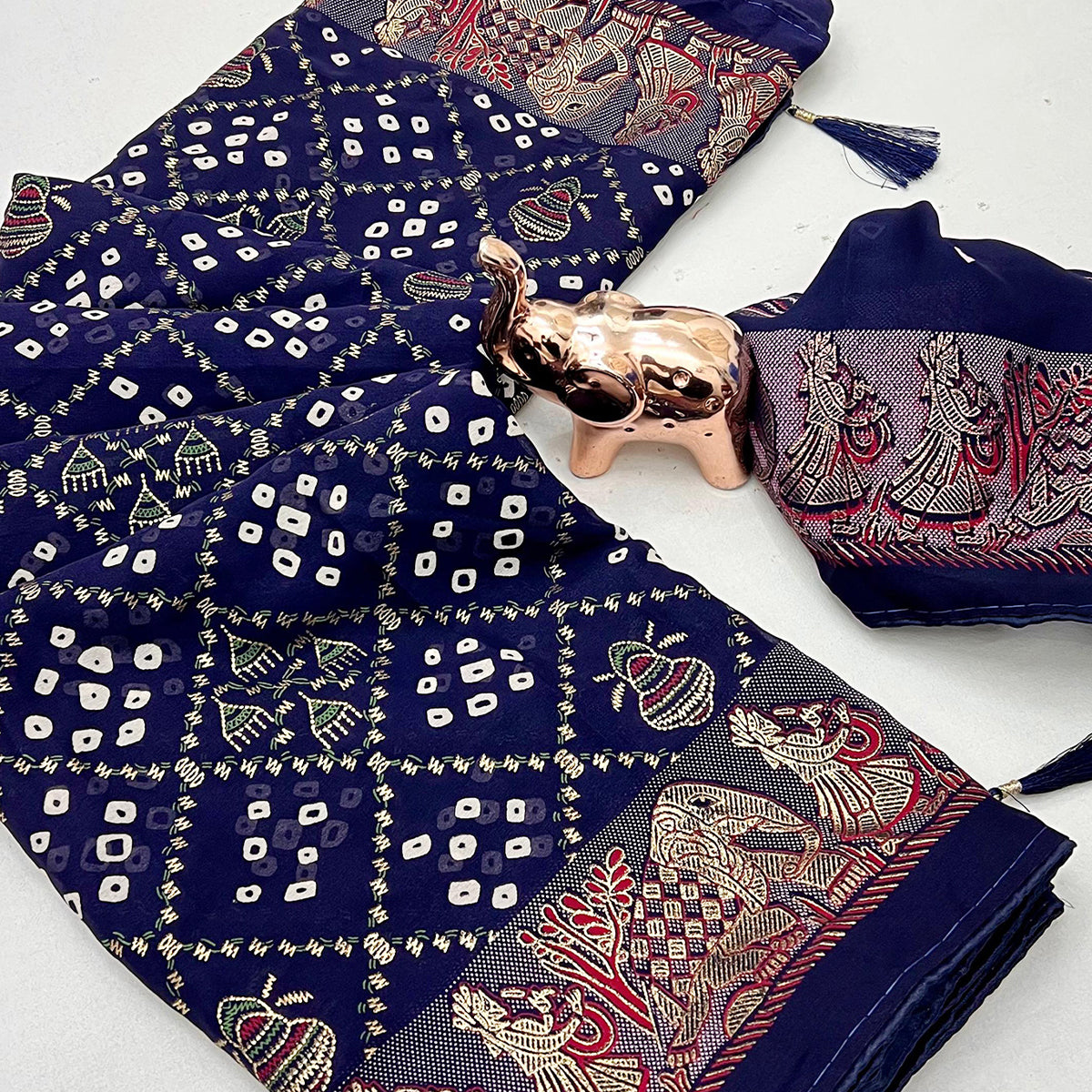 Elegant Navy Blue Bandhani Foil Printed Georgette Saree Highlighted With Soft Tassel Pallu