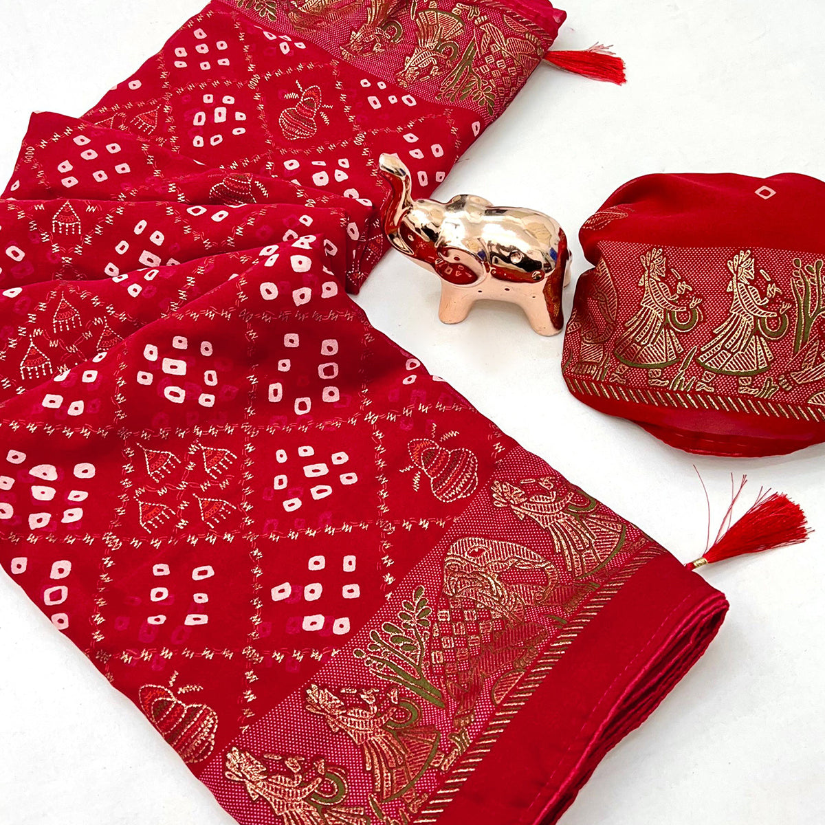 Elegant Red Bandhani Foil Printed Georgette Saree Highlighted With Soft Tassel Pallu