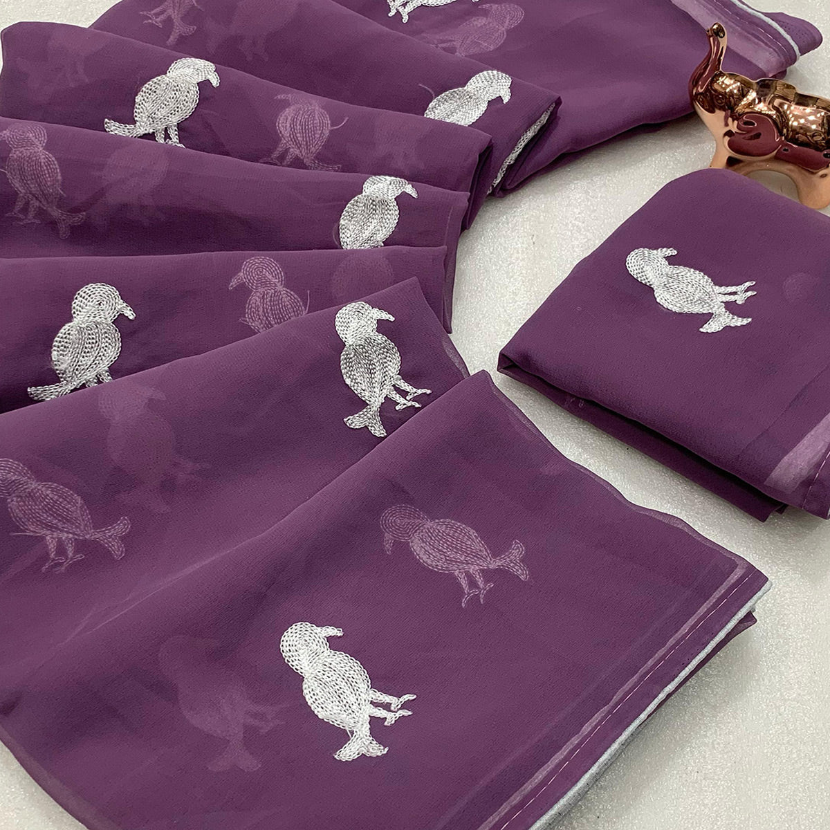 Light Purple Georgette Saree Adorned With Elegant Bird Embroidery