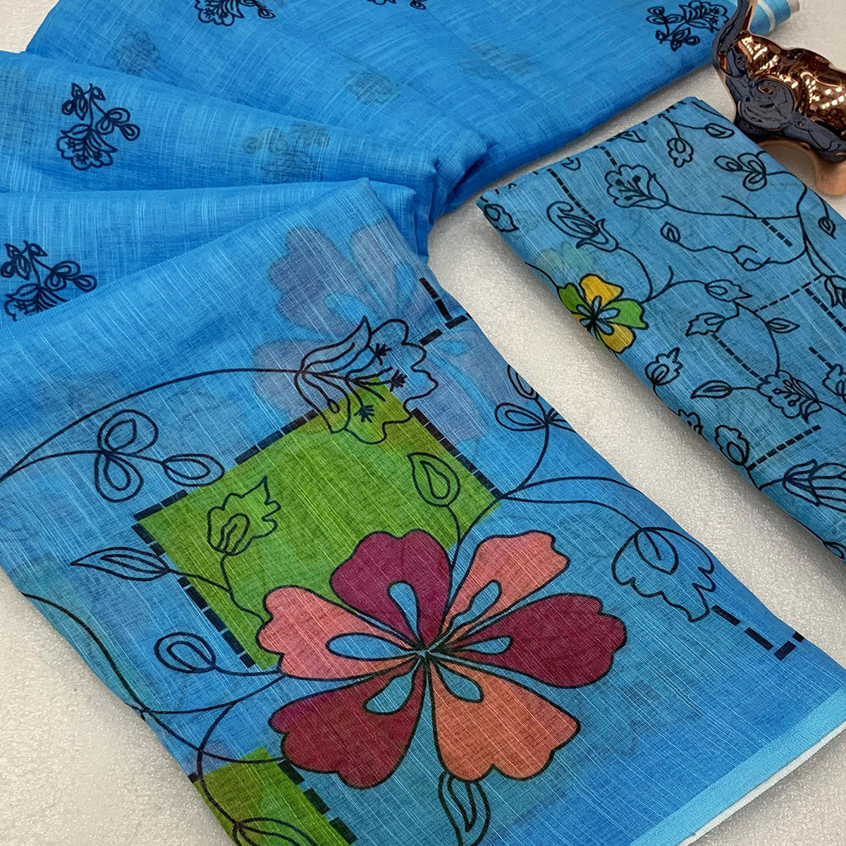 Sky Blue Floral Printed Linen Saree With Elegant Tassel Border