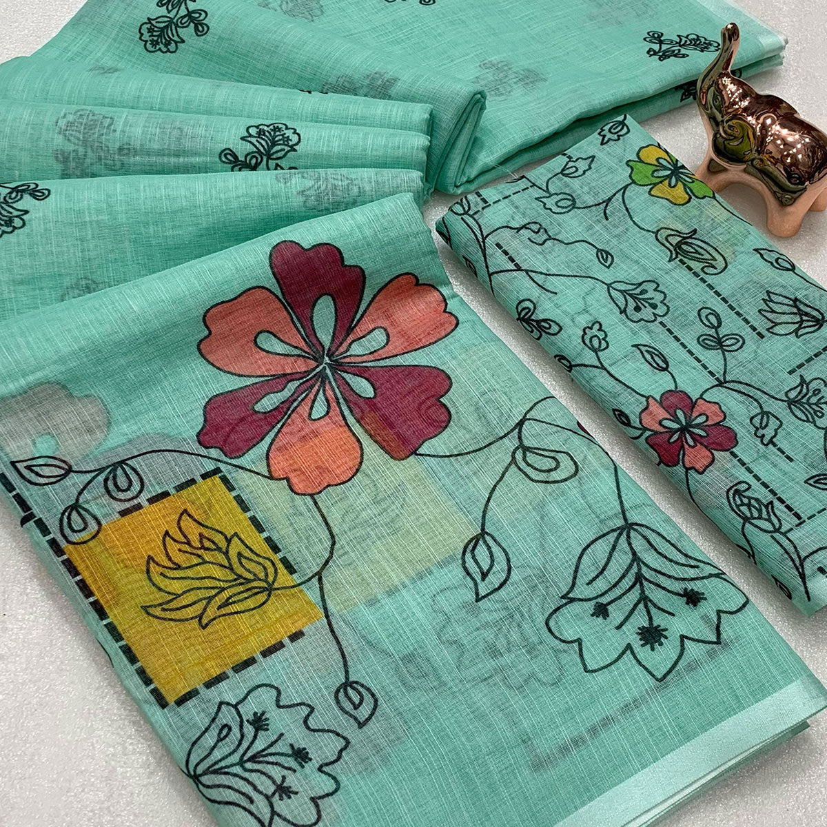 Turquoise Floral Printed Linen Saree With Elegant Tassel Border