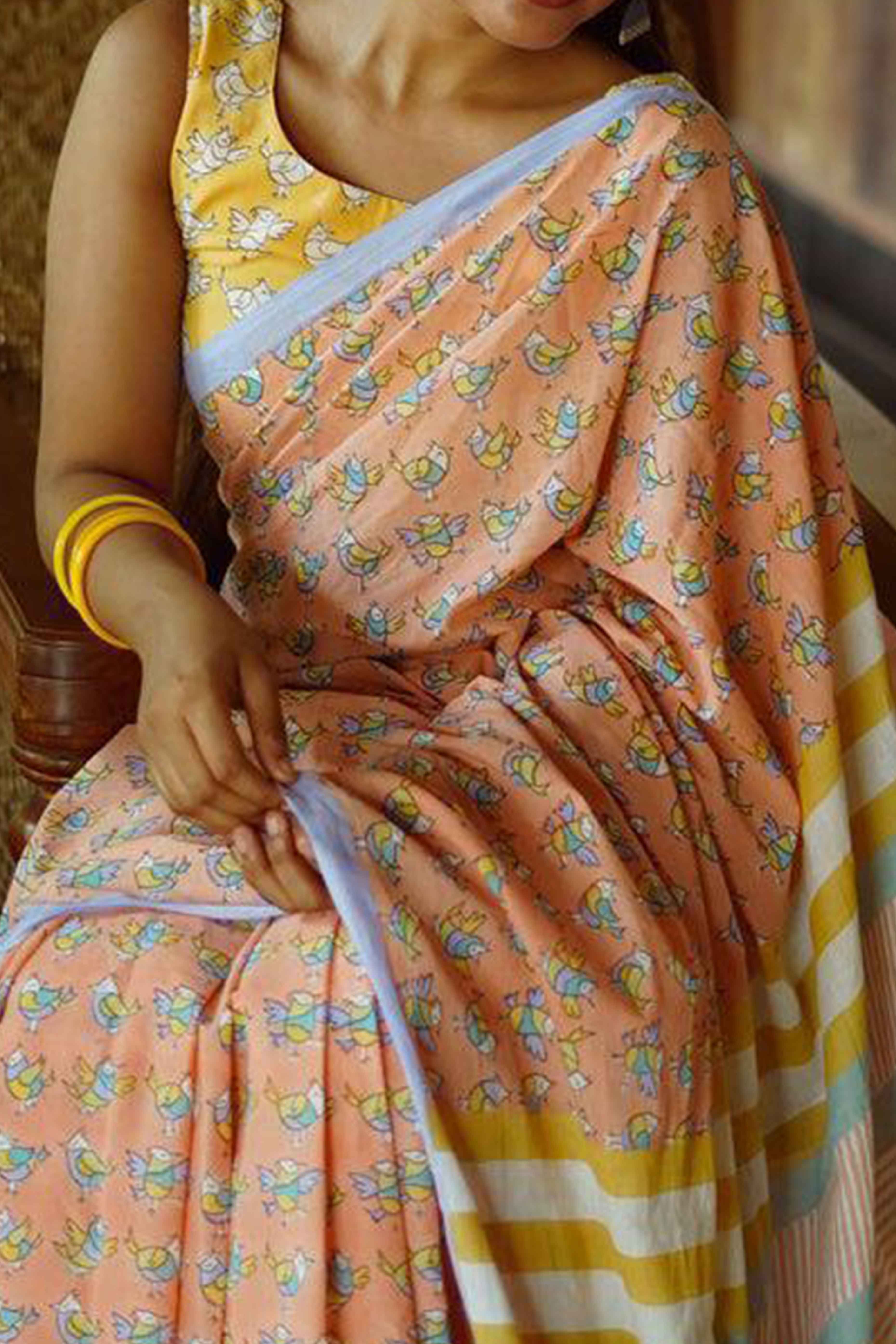 Light Orange Batik Printed Pure Linen Saree With Tassels