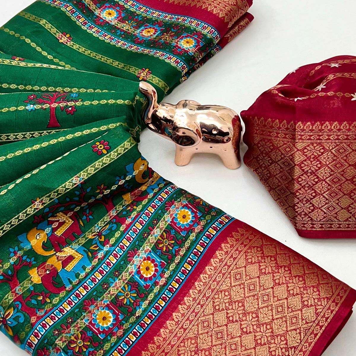 Regal Green Weaving Dola Silk Saree Adorned With Artistic Elephant & Floral Print