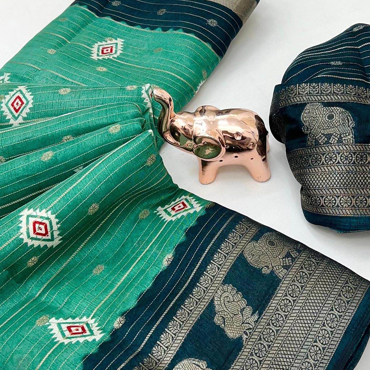 Charming Rama Green Printed Cotton Silk Saree With Elephant & Peacock Design Weaving Border