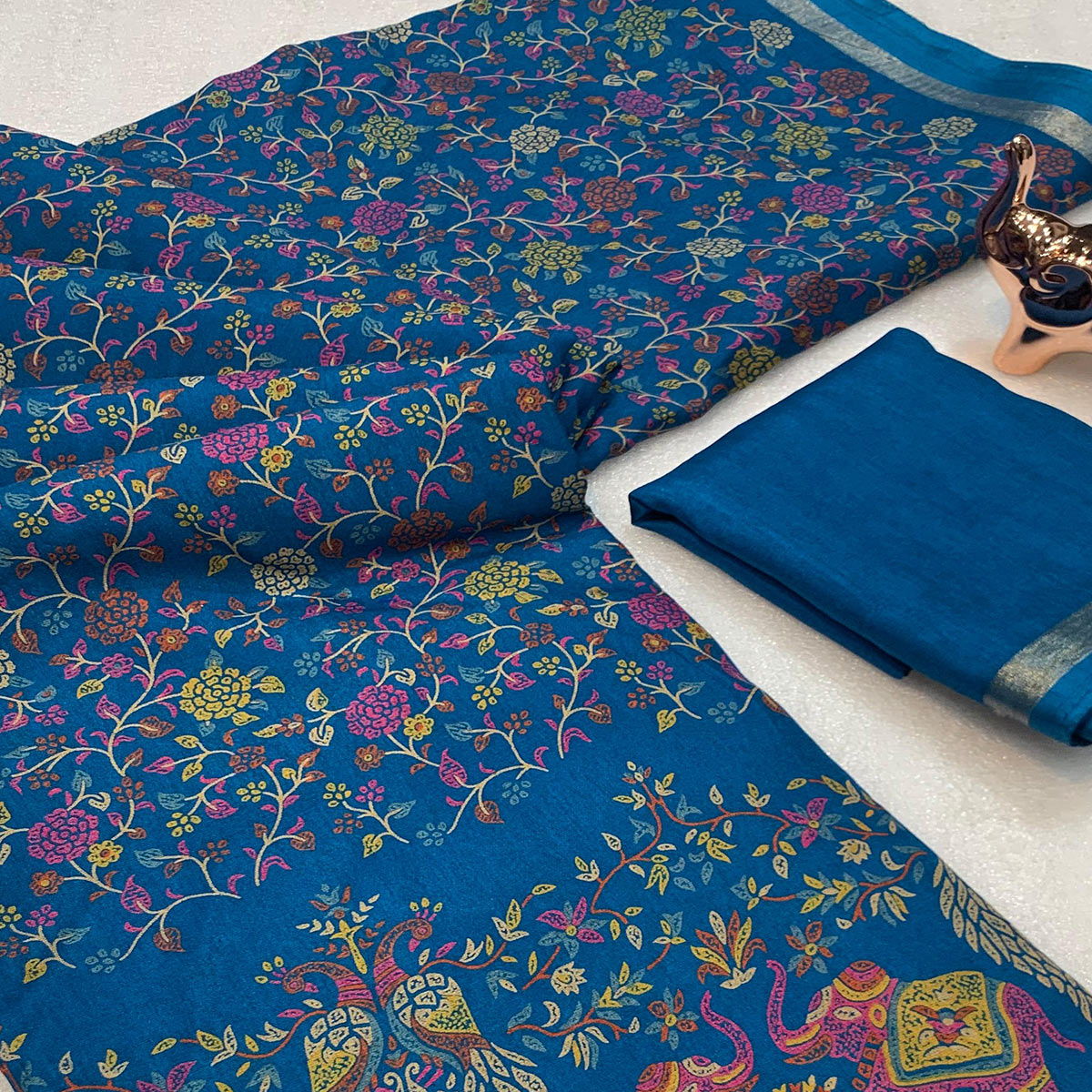 Blue Floral Printed Tussar Silk Blend Saree Accentuated With Rich Zari Border Work