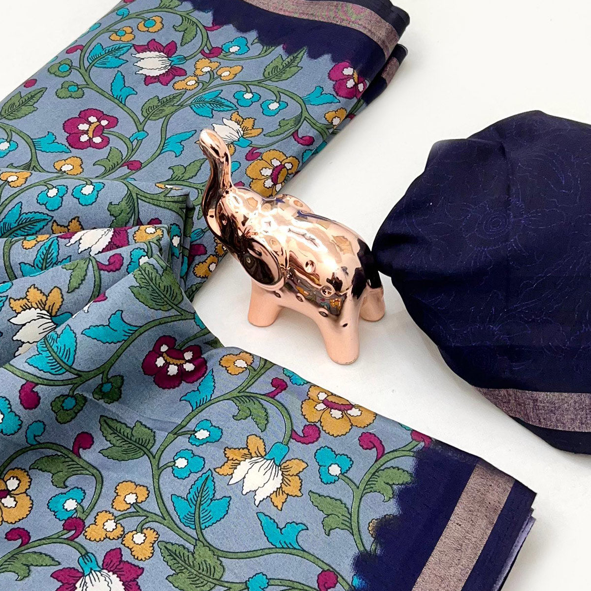 Grey Floral Printed Tussar Silk Blend Saree Enhanced With Intricate Zari Border Work