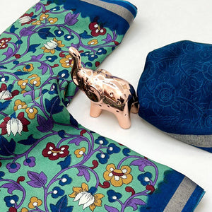 Sea Green Floral Printed Tussar Silk Blend Saree Enhanced With Intricate Zari Border Work