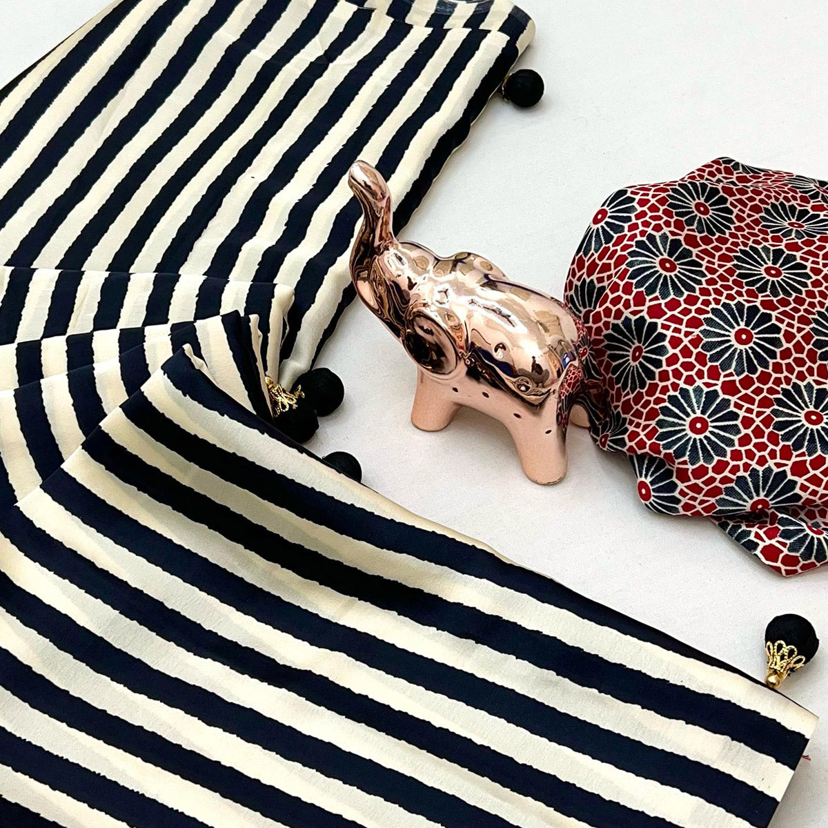 Luxe Partywear Saree in Black Satin with Modern Striped Print and Flowing Drape