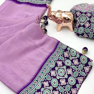 Lavender Solid Satin Saree Featuring Bold Ajrakh Print and Tassel Accented Pallu