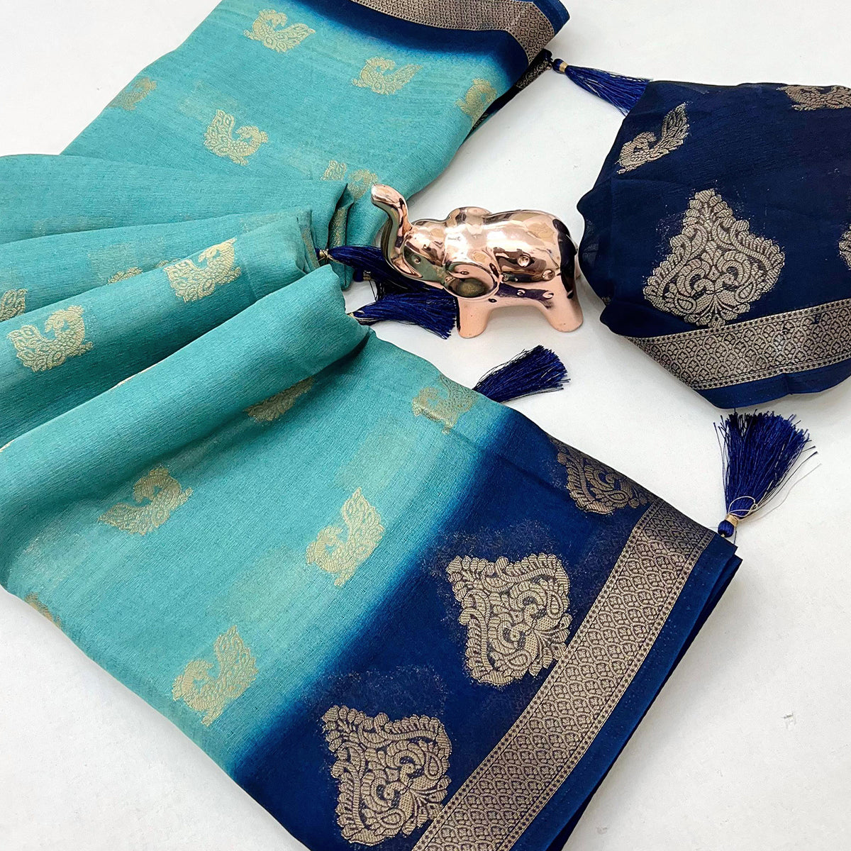 Elegant Blue Peacock Pattern Zari Weaving Georgette Saree With Tassel Pallu