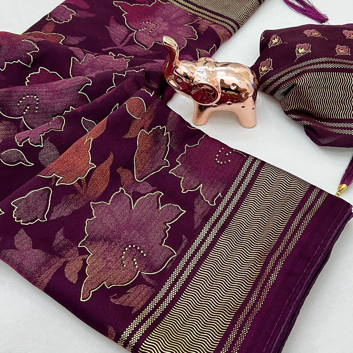 Wine Floral Foil Printed Georgette Saree With Tassels