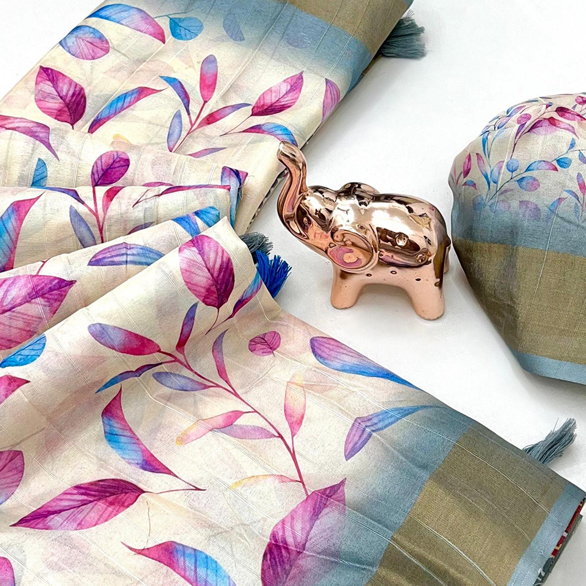 Festive Off White Silk Blend Saree with Subtle Floral Print and Shimmering Zari Border