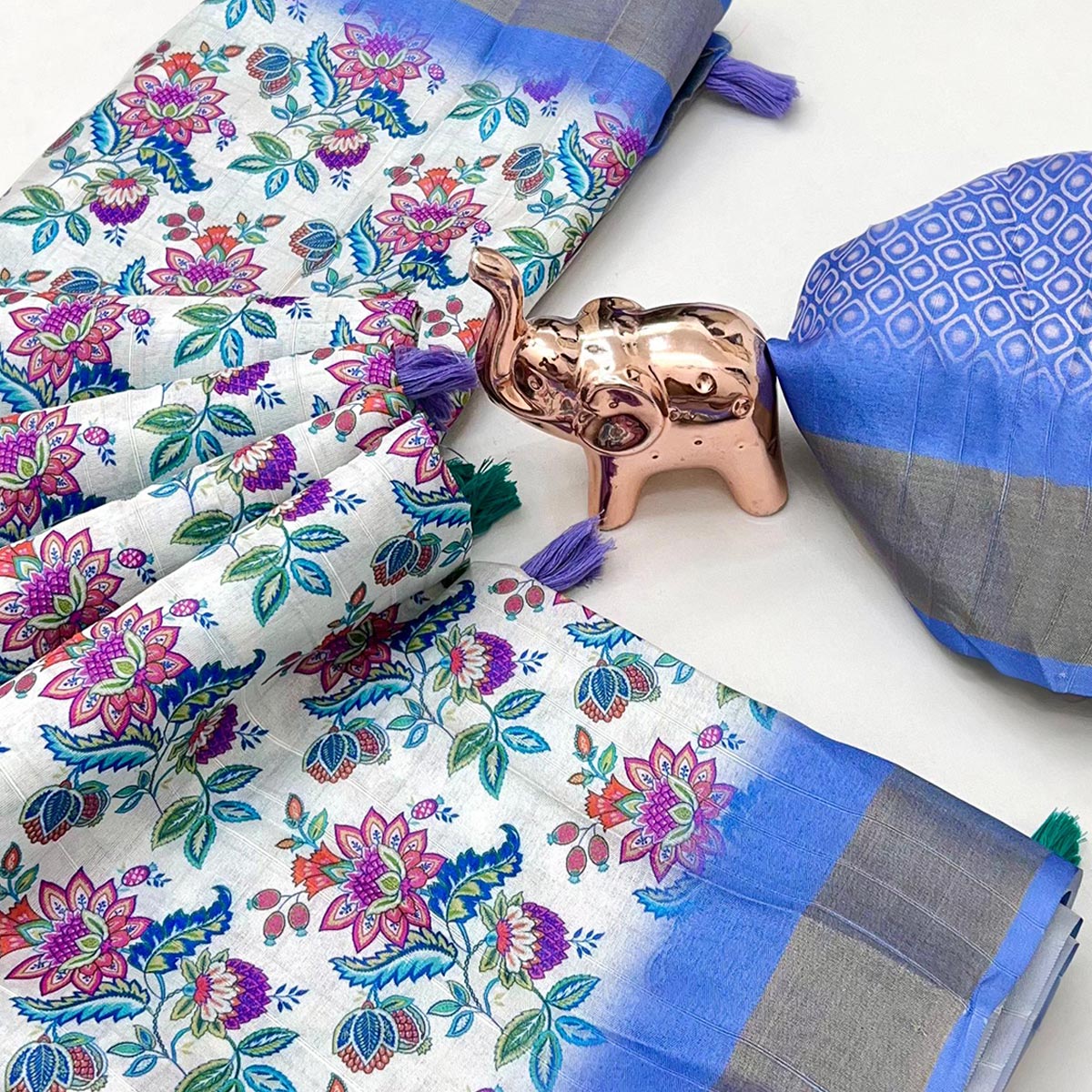 Festive White & Blue Silk Blend Saree with Subtle Floral Print and Shimmering Zari Border