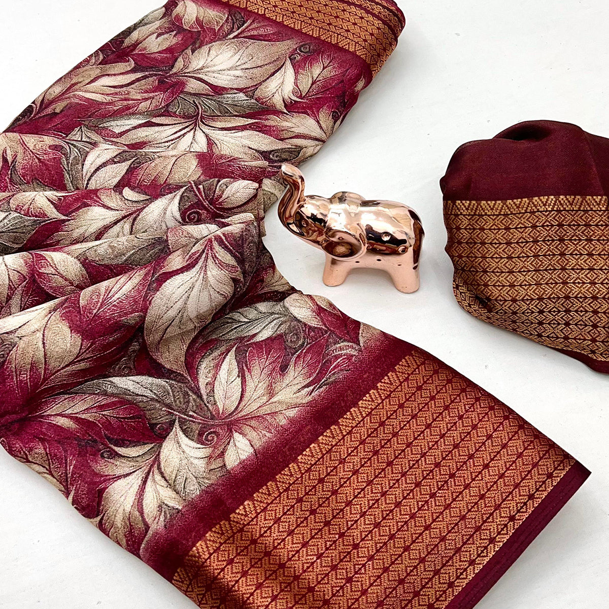 Maroon Leaf Printed Dola Silk Marshmallow Saree With Paisley Jaal Pallu & Lustrous Weaving Border