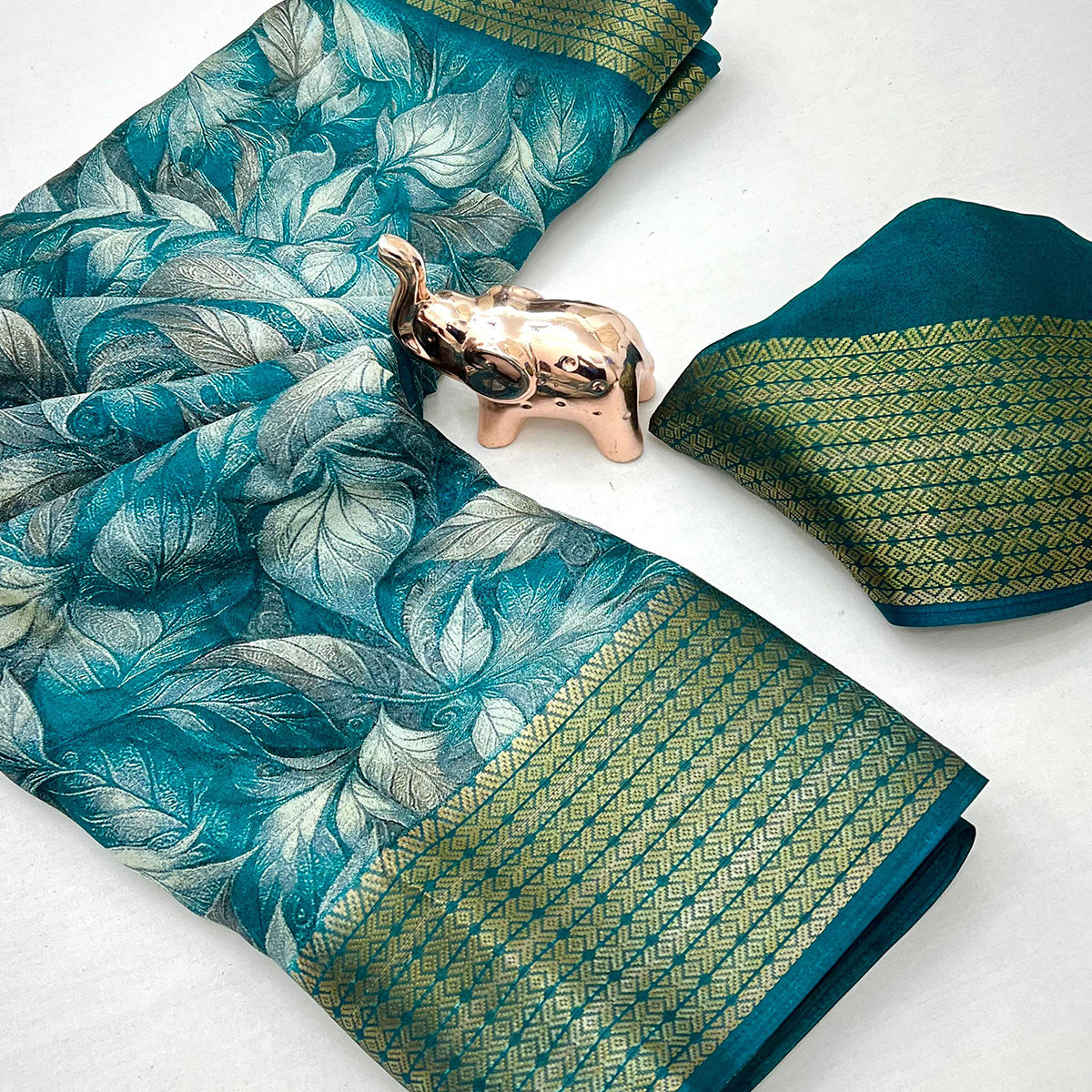 Teal Leaf Printed Dola Silk Marshmallow Saree With Paisley Jaal Pallu & Lustrous Weaving Border