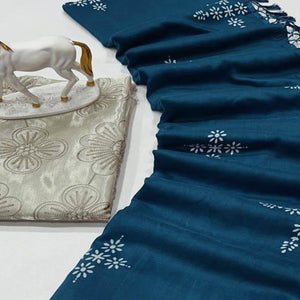 Peacock Blue Muslin Cotton Silk Saree Adorned With Delicate Floral Prints & Playful Tassels