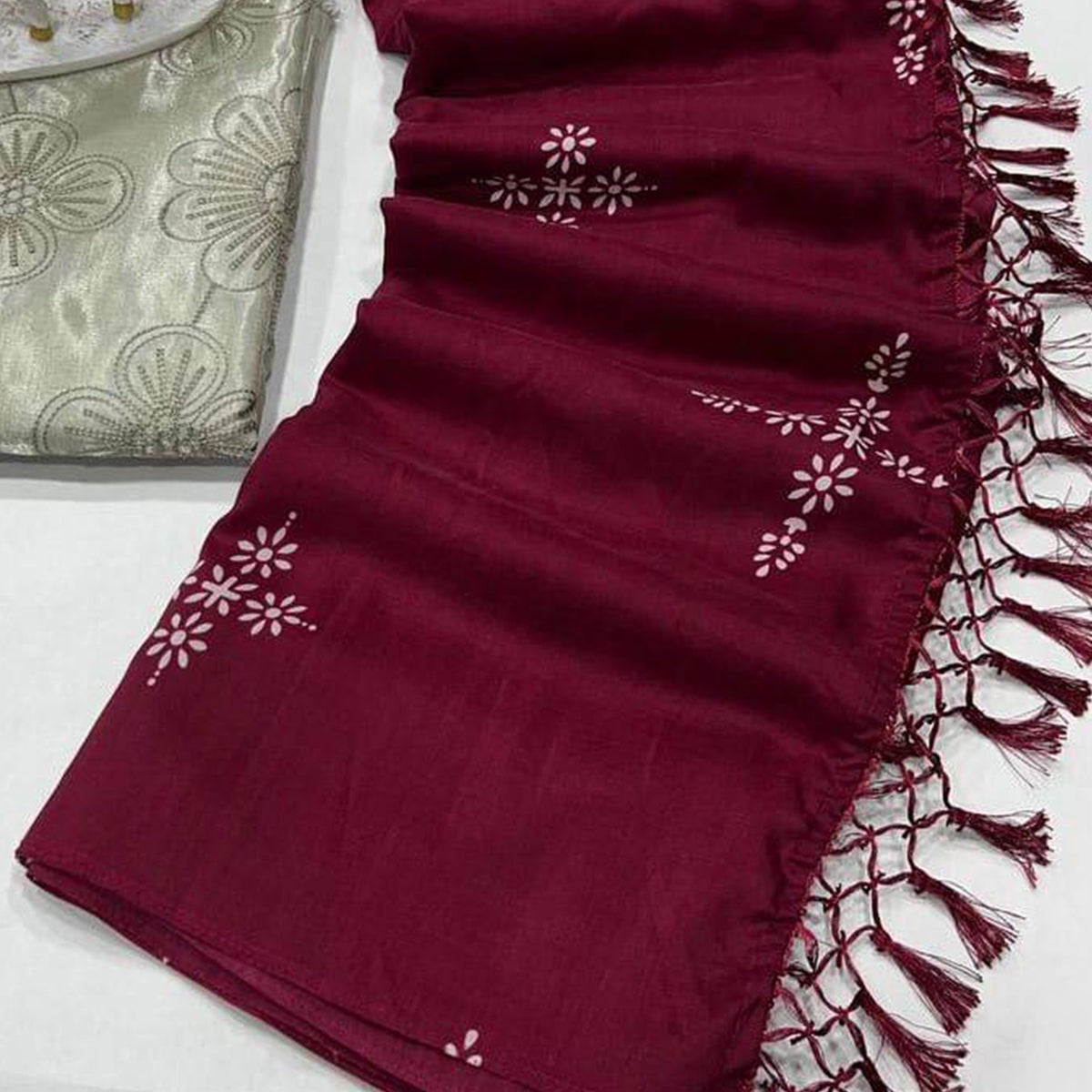 Wine Floral Printed Muslin Saree With Tassels